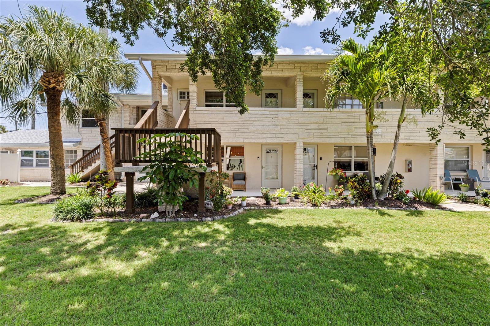 Welcome to your own slice of paradise in the heart of Indian Rocks Beach. Just two short blocks from the sugar-sand shoreline and sparkling Gulf waters, this beautifully reimagined 1-bedroom, 1-bath residence offers the perfect blend of modern comfort and laid-back coastal living. Completely remodeled from top to bottom, this spacious retreat features updated electrical, luxury flooring, a stunning new kitchen with stylish cabinetry, backsplash, and appliances, an elegantly renovated bathroom, designer lighting, and thoughtful finishes throughout. Every detail has been carefully selected to create a bright, inviting space that feels both sophisticated and effortlessly beachy. Step outside and discover a rare 3,000-square-foot garden oasis, providing a peaceful tropical setting for morning coffee, evening cocktails, or relaxing with your furry companion. Pet-friendly and welcoming, this property offers the perfect sanctuary for full-time residents, seasonal owners, or anyone seeking an easygoing beach lifestyle. Enjoy the convenience of a new roof installed in 2023, dedicated parking plus guest parking, and nearby pickleball courts for active outdoor fun. Leave the car behind and stroll to some of Indian Rocks Beach's most beloved local restaurants, cafés, parks, and entertainment venues. Experience the charm of a true beach town where friendly neighbors, community events, sunset gatherings, and waterfront festivals create an unmatched sense of place. Imagine beginning your mornings with a walk along the shoreline, listening to the soothing rhythm of the waves, spending afternoons exploring local shops and waterfront dining, and ending each day with breathtaking Gulf sunsets. Whether you're searching for a personal coastal retreat, a winter escape, or a carefree beach residence, this move-in-ready gem delivers the quintessential Indian Rocks Beach lifestyle you've been dreaming of. Coastal charm, modern updates, tropical surroundings, and an unbeatable location—this is beach living at its finest!