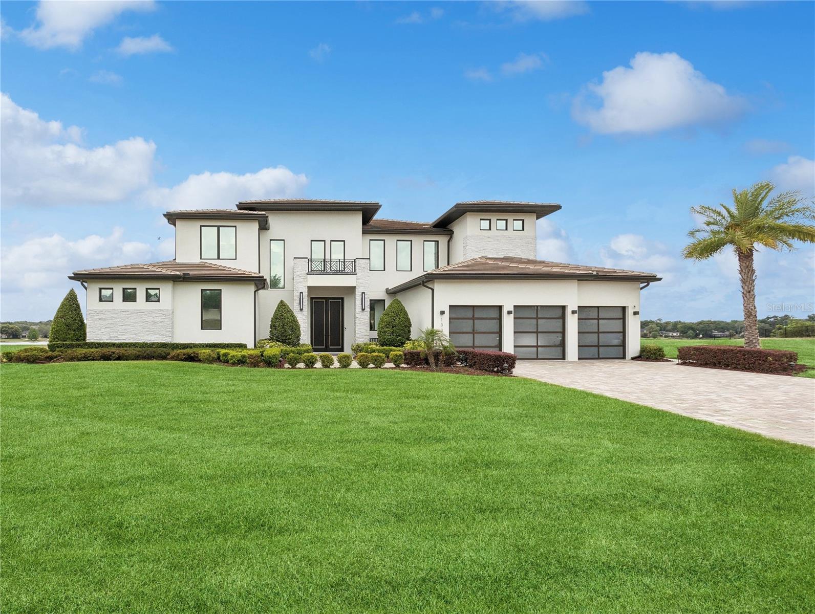 UNDER CONTRACT AND TAKING BACKUP OFFERS! Beautiful, Breathtaking and LAKEFRONT in Windermere!  This fantastic 5 Bedroom/6 Bath, 2 story home is the epitome of grandeur and elegance.  Step through the dramatic double front doors and feel the world open around you...up to the 28 foot soaring ceilings, and out past the gorgeous infinity pool to the glistening waters of Lake Olivia. Envision every day life in an open floor plan that includes the dining room, family room, and gourmet chef's kitchen complete with Thermador appliances. Luxuriate in the palatial primary suite comprised of a large bedchamber with a fabulous lake view, a regal primary bath, and two walk in closets...one of which measures 21x16 feet!  Upstairs, the second, third, fourth, and fifth bedrooms all have their own exquisite en suite full baths. Meander through the house and take note of the incredible upgrades, from the remote control Hunter Douglas blinds to the top-of-the-line ceiling fans and crystal chandeliers.  Venture out to the tranquil lanai with its retractable screens, and admire the stunning summer kitchen adorned with imported tile.  Be a part of Lake Olivia Reserve, an exclusive, private, gated lakefront community with only 12 homesites. Conveniently located just minutes from downtown Windermere, the shops & restaurants of Winter Garden Village, and downtown Orlando. Less than 30 minutes to all local attractions. This home is turn key and move-in ready. Call for your private showing appointment today!