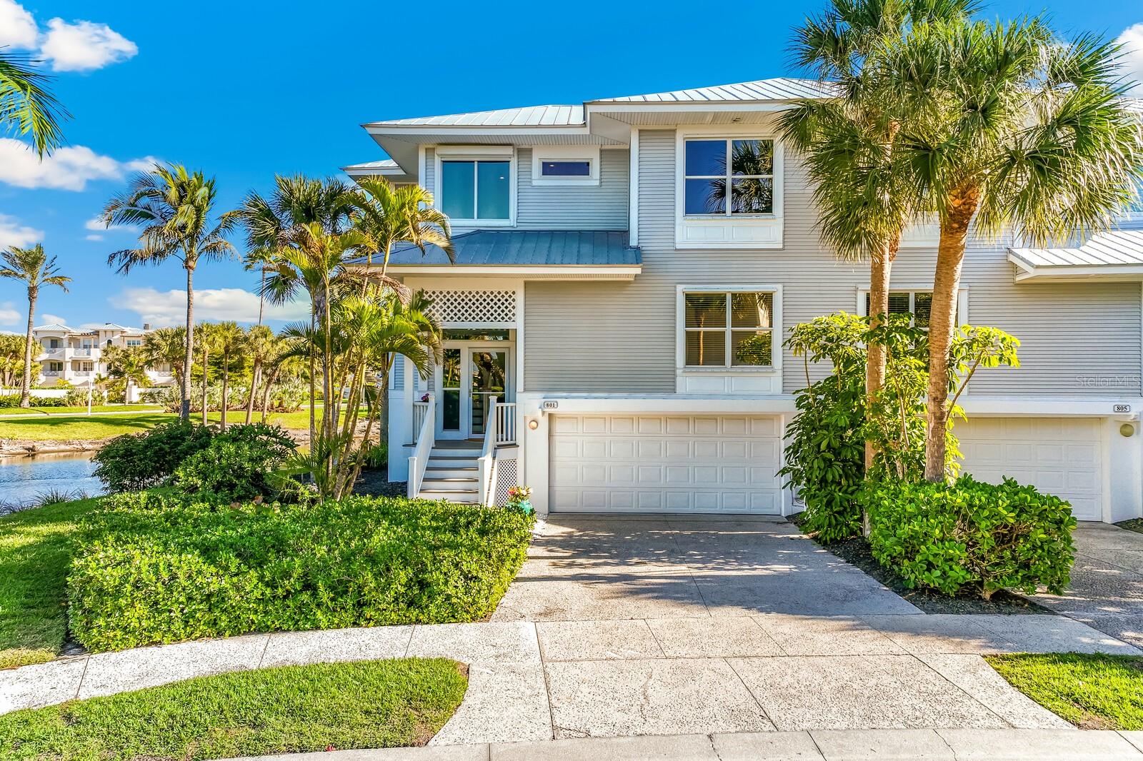 For Sale: A stunning 3-bedroom, 3-bathroom townhouse on a unique lot nestled in the desirable southernmost section of the Boca Bay Beach View association with 150’ of lake frontage. 

This beautifully designed 1,910 square foot residence welcomes you with vaulted ceilings and abundant natural light streaming through generous windows. The living room seamlessly extends into an enclosed sun porch, creating the perfect space for quiet mornings and peaceful evenings spent watching the sunset glow. Wraparound lake views provide a tranquil backdrop throughout, while a convenient elevator ensures effortless movement between floors.

The spacious kitchen features updated appliances and solid-surface countertops, offering a functional workspace for culinary endeavors of any scale. The top floor primary suite serves as a private sanctuary, complete with a private bathroom with soaking tub and walk in shower, a spacious walk-in closet, and a deck overlooking the water perfect for moon gazing. Two additional bedrooms and bathrooms provide excellent flexibility for guests, a home office, or personal retreat space.

The lower level presents a covered patio with walkout access to a grassy area, ideal for relaxation or outdoor enjoyment. A rare 3-car garage accommodates vehicles and all the recreational gear that coastal living requires. Added peace of mind comes from a recently installed roof in 2023.

Ownership includes Boca Bay Pass Club membership, granting access to exceptional amenities: a Gulf-front restaurant, sunset lounge, poolside dining, a professional tennis program with seven Har-Tru courts, four community pools, a fishing pier, beach club, and short-term boat docks. The Pass Club and pristine Gulf beaches are just a pleasant stroll away.

This thoughtfully appointed townhouse represents an outstanding opportunity to embrace the coastal lifestyle in one of the area's most desirable communities. Contact us today to arrange your private showing.
