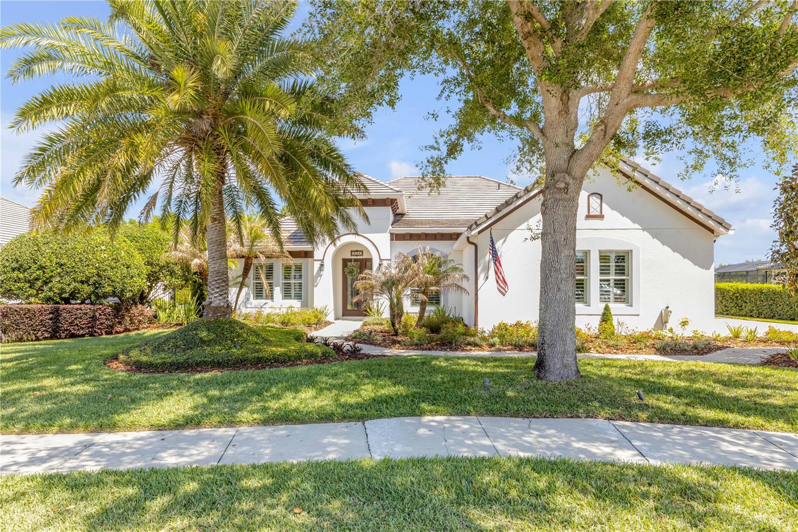 Discover refined tropical living in one of Mount Dora’s most coveted gated enclaves. This beautifully crafted single-story ranch residence offers an exceptional blend of architectural grace, modern upgrades, and effortless indoor-outdoor living.

A whole-house generator paired with an upgraded 500-gallon LP tank ensures uninterrupted comfort, powering both the home and the heated, solar-enhanced pool—your private resort sanctuary framed by lush Florida greenery.

Inside, the home reveals a gorgeous open layout anchored by elegant French doors in the main living area, inviting natural light and seamless flow to the outdoor retreat. New premium appliances, including a double oven, elevate the culinary experience, while oversized guest suites offers generous closets and serene privacy.

Thoughtful enhancements elevate every space, including custom fans in every room, with oversized designer fans gracing both the main living area and the primary suite. Additional upgrades—no carpet throughout, whole-house surround sound, and refined finishes—enhance the home’s timeless appeal and livability.

A rare opportunity to own a residence that embodies the essence of luxury, comfort, and tropical tranquility within the beautiful community of Loch Leven.