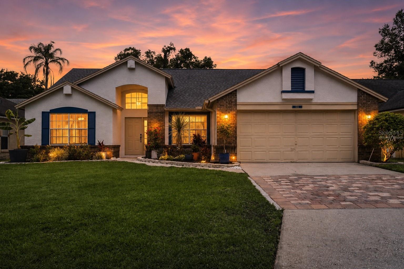 One or more photo(s) has been virtually staged. Welcome home to 1351 American Elm Drive — a beautifully maintained 4-bedroom, 2-bathroom residence offering 1,978 square feet of thoughtfully designed living space in one of Altamonte Springs' most sought-after communities. From the moment you arrive, the home's charming curb appeal sets the tone — a freshly manicured lawn, decorative paver driveway and classic brick and stucco exterior exude pride of ownership. Inside, soaring vaulted ceilings and an abundance of natural light create an open, airy atmosphere throughout. The split-bedroom floorplan offers both privacy and functionality. The formal dining room — adorned with a stylish geometric pendant light and warm laminate flooring — flows seamlessly into the heart of the home. The open-concept kitchen features stainless steel appliances, a convenient snack bar, and overlooks the spacious family room, making it ideal for entertaining or everyday living. A charming barn door leads to the pantry, adding a touch of character to the space. Retreat to the generous primary suite, complete with vaulted ceilings and dual windows for great natural light. The updated primary bathroom showcases a walk-in glass shower with etched glass doors, dual sinks, and a water closet for added privacy. The primary closet features custom built-ins, maximizing organization and storage. The second bathroom has been completely renovated with modern wood-look tile, updated vanity, brushed nickel fixtures, and a sleek barnwood-framed mirror. A true Florida bonus — the sun-filled Florida Room offers additional living space year-round, with floor-to-ceiling sliding glass doors that flood the room with natural light and open directly to the patio and fully fenced backyard. Whether you're enjoying morning coffee or hosting gatherings, this private outdoor retreat is sure to impress. Major updates provide confidence and peace of mind: AC 2018 | Roof 2021 | Whole-House Repipe 2021 | Water Heater 2021. Situated minutes from everyday essentials and local favorites, with effortless access to I-4, SR 436, and SR 434. Winter Park, Maitland, AdventHealth Altamonte, and major employment centers are just a short drive away. Residents enjoy beautiful walking trails and a full suite of community amenities — swimming pools, tennis courts, basketball courts, and inviting clubhouses. With its ideal location, meaningful updates, and inviting layout, this home delivers the perfect blend of comfort, convenience, and Central Florida living. Schedule your private showing today!