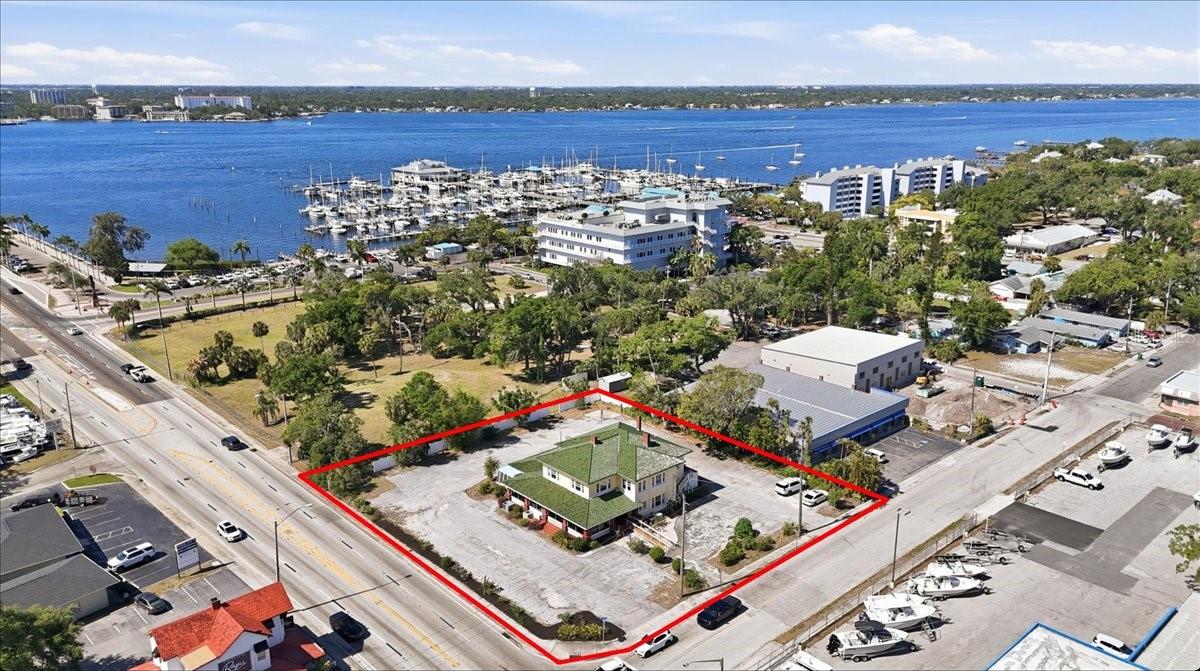 A rare opportunity to acquire a prominent, historic commercial property positioned along one of the most traveled corridors in North Manatee County. Built in 1923, this iconic structure blends timeless character with functional scale, offering over 6,000 square feet across two levels on a 0.76-acre site with exceptional visibility and access.

The main level features multiple dining & special event rooms, ideal for restaurant, hospitality, retail, or adaptive reuse. Existing infrastructure includes a 10x10 walk-in freezer and 10x10 walk-in refrigerator, supporting food and beverage operations, along with a designated dumpster pad for service efficiency. The property is also equipped with ADA ramp access and abundant on-site parking for 50+ vehicles, a significant advantage for this corridor.

The second floor (approx. 1,930 SF) offers flexibility with six rooms (bedrooms or offices) and three fireplaces, well-suited for executive offices, boutique workspace, or potential conversion to suites.

Located directly on Business 41 (8th Ave W), the property benefits from high daily traffic counts of 30,000 to 40,000+ vehicles (seasonal), providing strong exposure for owner-users or investors seeking a high-visibility asset.

Surrounding development is accelerating. A 152-unit riverfront mixed-use project is underway adjacent to the site, along with an additional 80-unit mixed-use development featuring 15,000 square feet of retail just one block away, bringing increased density and long-term value to the immediate area.

Palmetto continues to evolve as a historic waterfront destination along the Manatee River, ideally positioned between St. Petersburg and Sarasota. Demand is rising for authentic, locally driven concepts that embrace the area’s coastal heritage and walkable downtown character.

The nearby Palmetto Marriott Resort & Spa and Bradenton Area Convention Center have recently completed construction and are now attracting larger regional events, further supporting commercial growth and business opportunity in the corridor.