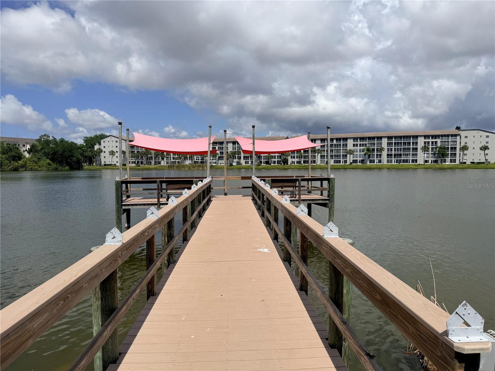 AWESOME LAKE VIEWS FROM THIS 2/2 CONDO on the 4th floor!  Bayshore on the Lake - don't miss out on this great little investment or retirement opportunity!  Fully TURNKEY FURNISHED condo in a location that can't be beat!  1100 SF that lives large!  Spacious bedrooms, plenty of storage in the unit as well as on the lanai - washer and dryer on one end and a full size storage closet on the opposite end.  Kitchen is just inside the front door and has everything you need - and owner has recently purchased a new refrigerator.  Ceramic tile throughout the main living areas and carpet for comfort in the bedrooms.  Enjoy as a vacation getaway - lock and leave!
Bayshore on the Lake is an active 55+ community featuring a fishing pier, shuffleboard, heated swimming pool, grills, and clubhouse just steps away! All of this tucked into a little pocket and so close to the epicenter of Bradenton-walkable to shopping, restaurants, nightlife, etc. Only a 10 minute drive to Bradenton Beach as well. Welcome to this super clean and updated condo in this great and active condo community!!