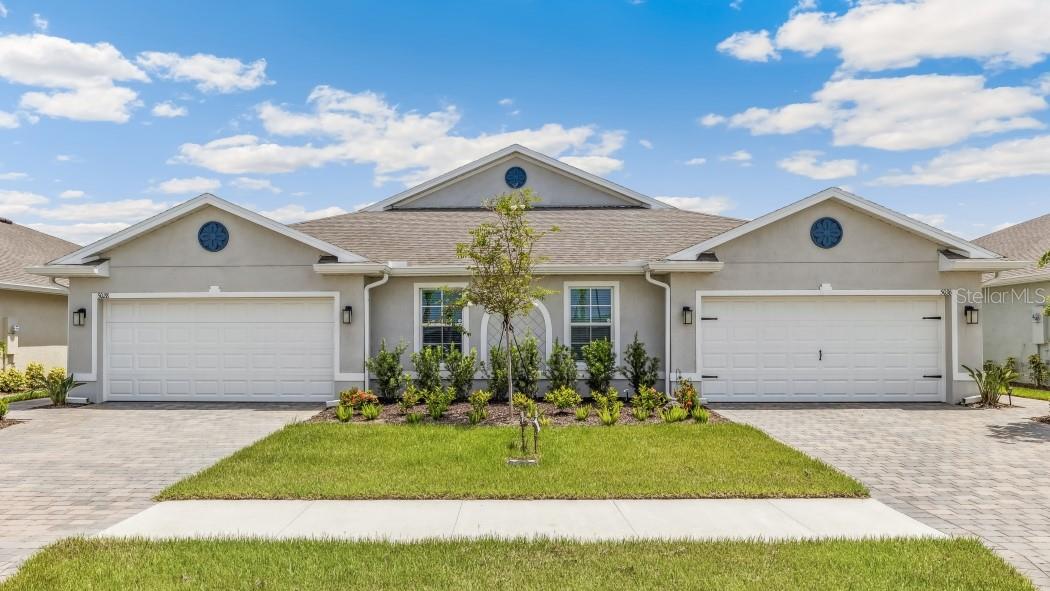 This beautiful Twin Villa boasts a welcoming open floorplan as you walk in. You will love the beautiful open kitchen with a lot of cabinet storage, a large island, and walk-in pantry, making your home great for cooking and entertaining. All stainless steel kitchen appliances with oven, microwave, dishwasher, refrigerator, and garbage disposal are included. The Carrington villa has 3 bedrooms and 2 full baths with ceramic tile flooring throughout, tile shower walls, quartz countertops, and impact windows. You'll enjoy the great outdoor space on the large screened in lanai. Lawn care and irrigation is included! Central Parc is a low maintenance, low HOA/CDD, gated community with resort style pool, hot tub, fitness center, clubhouse with full kitchen, tennis, and pickleball courts! Come visit to see if Central Parc is the perfect community for you!