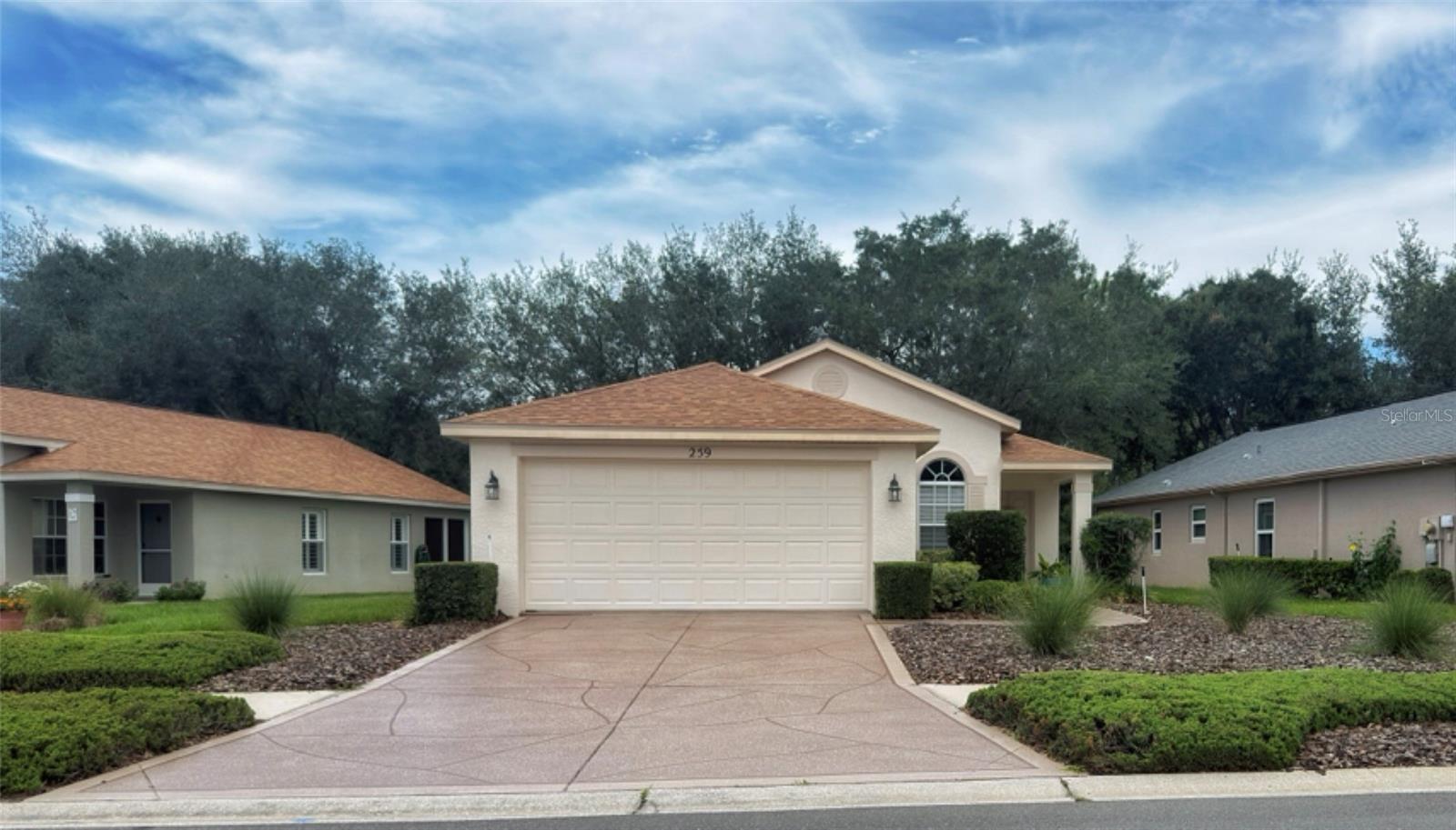 Welcome to 259 Center Oak Circle, located in the highly sought-after Wellington at Seven Hills community, a premier 55+ community where exceptional amenities and low-maintenance living come together. This beautifully maintained 2-bedroom, 2-bathroom patio home is truly move-in ready, offering thoughtful updates and a peaceful setting you’ll appreciate from the moment you arrive.
Major improvements provide peace of mind, including a new roof and HVAC system installed in 2023. The primary bathroom was enhanced in 2025 with a beautifully updated shower featuring an elevated floor for easier entry and exit. Rain gutters were added in 2025. Most recently, in 2026, the driveway and sidewalks were upgraded with an attractive acrylic coating that creates outstanding curb appeal and a welcoming first impression.
Inside, you’ll find comfortable living spaces, while the backyard offers exceptional privacy with a tranquil, park-like backdrop—an ideal place to relax with your morning coffee or unwind at the end of the day.
As a maintenance-free patio home, exterior lawn care and landscaping is handled for you, giving you more time to enjoy everything Wellington at Seven Hills has to offer. Residents have access to beautifully landscaped grounds, a resort-style pool, tennis and pickleball courts, a fitness center, and a country club with an on-site restaurant, providing countless opportunities for recreation, dining, and social activities.
The home is being sold furnished with the exception of the 2nd bedroom furnishings, a decorative table, the grandfather clock and select accessories.  If you’re looking for a move-in ready home in one of the area’s most desirable 55+ communities, 259 Center Oak Circle is an opportunity you won’t want to miss.