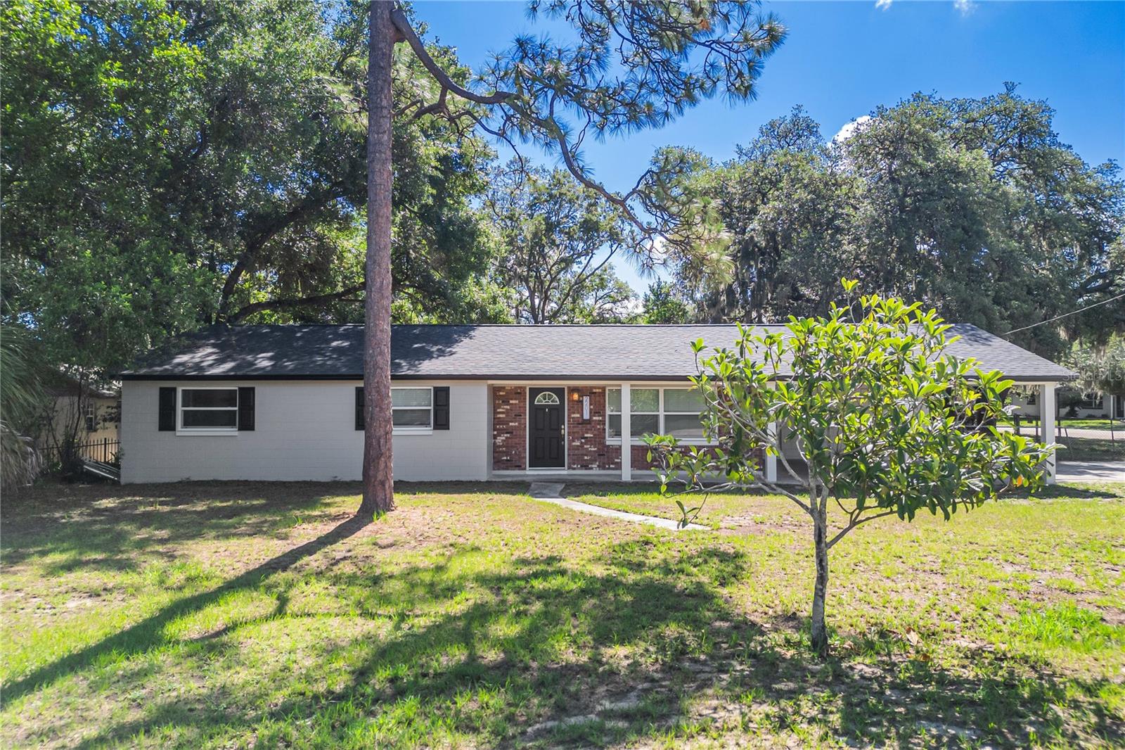 Welcome home to this beautifully updated 3-bedroom, 2-bath residence located in one of Longwood's most desirable communities. Zoned for highly rated Wekiva Elementary and Lake Brantley High School, this home offers an exceptional combination of location, comfort, and convenience.  Inside, you'll find updated tile flooring throughout the entire home—no carpet anywhere—creating a modern look that's both stylish and easy to maintain. The spacious layout is complemented by a roof that is less than two years old, offering added peace of mind for the new owner.  Situated on an oversized lot, the property features a fully fenced backyard with plenty of space for pets, play, gardening, or future outdoor living enhancements.  Enjoy life in a well-established neighborhood with access to a private boat ramp on Lake Brantley and the flexibility of no mandatory HOA. Conveniently located near popular restaurants, shopping, parks, and major commuter routes, you'll have everything you need just minutes from your doorstep.