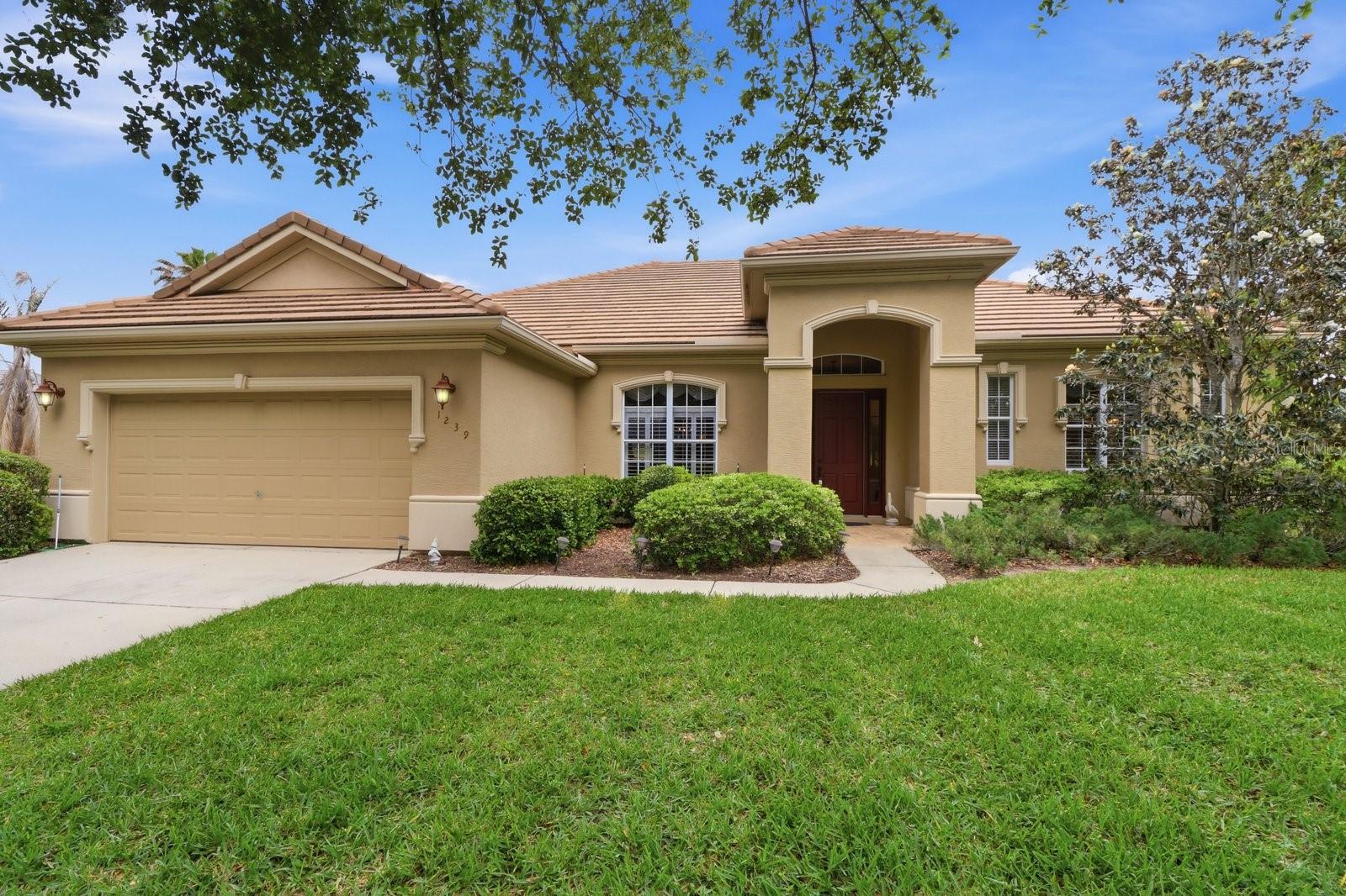 LIVE THE FLORIDA LIFESTYLE IN TERRA VISTA-where golf course living, scenic pond views, and resort-style amenities come together at 1239 W Beagle Run Loop. This well-maintained 3-bedroom, 2-bath home offers 2,338 square feet of living space and sits on an oversized 0.38-acre lot, providing both room to spread out and peaceful views that can be enjoyed from inside the home and while relaxing on the screened-in lanai. Step inside to find high ceilings that enhance the open and airy feel, along with a thoughtfully designed layout that flows comfortably for everyday living and entertaining. Natural light fills the living spaces, creating a warm and inviting atmosphere throughout. The kitchen is both functional and inviting, featuring a central island that provides additional storage and extra space for meal prep, making it great for cooking and gathering. The primary suite is designed for comfort and relaxation, featuring a tray ceiling, a spacious walk-in closet, and a well-appointed bathroom complete with a double vanity, step-in shower, and a soaking tub. The screened-in lanai provides a comfortable space to enjoy Florida living year-round, whether you're sipping your morning coffee or winding down in the evening while overlooking the tranquil pond. The home is topped with a tile roof, known for its durability and long lifespan. Tile roofs are commonly found in Florida due to their ability to hold up well in heat and harsh weather conditions, while also offering energy efficiency and a distinctive architectural look. Living in Terra Vista means enjoying a lifestyle centered around exceptional amenities. Residents have access to a championship golf course with scenic fairways, a clubhouse, resort-style pool, fitness center, spa, tennis courts, walking trails, and a full calendar of social activities. Conveniently located near shopping, dining, and the natural beauty of Citrus County, this home offers an incredible opportunity to enjoy life in one of the area's premier gated communities.