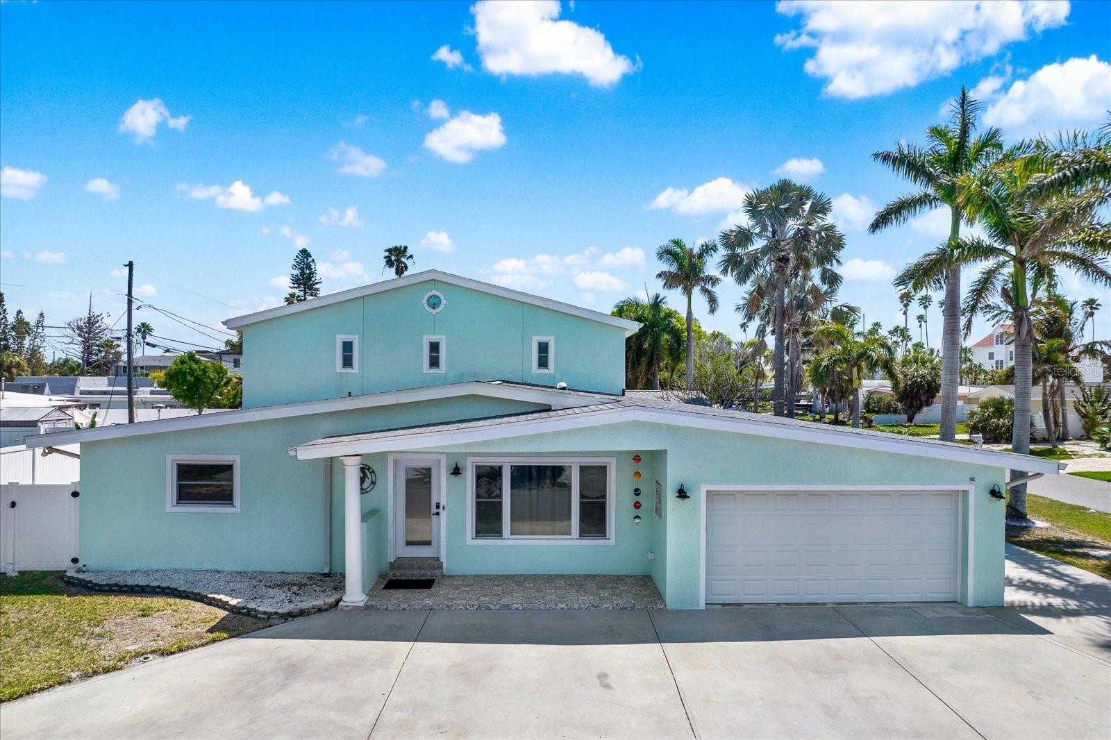 Welcome to your beautifully remodeled coastal retreat in the highly sought-after community of Redington Beach! Situated on a PRIME CORNER LOT, this 3-bedroom, 3-bathroom home combines modern upgrades, functional design, and charming beachside appeal. The property experienced flooding during Hurricane Helene but has been completely and professionally renovated with all permits closed, offering peace of mind and true move-in-ready living.
Step inside to a open floor plan, thoughtfully designed to maximize space and flow perfect for both everyday living and entertaining. The main level features two generously sized bedrooms and two full bathrooms, ideal for guests or multi-generational living. Upstairs, you'll find a spacious private suite with its own full bathroom, creating the perfect primary retreat or secluded guest quarters.
The home also features an INTERIOR LAUNDRY area for added convenience and a spacious 2-car garage for storage and parking. Outside, enjoy a large, fully usable backyard with endless possibilities—room for a pool, outdoor kitchen, or garden oasis. The expansive screened-in porch is perfect for relaxing, dining, or entertaining while enjoying the coastal breeze year-round. 
With inviting curb appeal, fresh updates throughout, and a layout that suits a variety of lifestyles, this home is truly turnkey. Located just steps from the pristine Gulf beaches, you'll enjoy easy access to white sand, stunning sunsets, and nearby local dining and shops. Whether you're searching for a primary residence, vacation getaway, or investment property, SHORT-TERM RENTALS ARE ALLOWED, this Redington Beach gem offers exceptional value and coastal living at its finest!