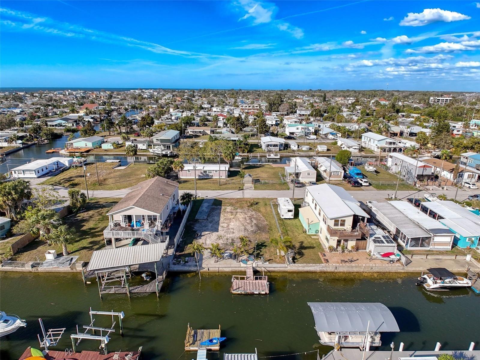 Want to go FISHING AND BOATING IN THE GULF? You will be a SHORT BOAT RIDE INTO THE GULF OF AMERICA! This CLEARED WATERFRONT LOT is located in sunny Hudson, FL featuring 60ft of WATERFRONT, a CONCRETE SEAWALL w/TOP WALK, a 12X32ft CONCRETE WATERSIDE PATIO, a MOBILE HOME PAD, WATER and SEWER CONNECTED and ELECTRICITY at the POLE! Watch the dolphins and manatee swim by while you take in the sunset. You can BUILD YOUR WATERFRONT DREAM HOME ON THIS GORGEOUS PROPERTY. Bring your vision for your Florida vacation home or full time waterfront dream. There is plenty of waterfront dining in the neighborhood, come see where the locals hang out! 
Please do not walk of dock!