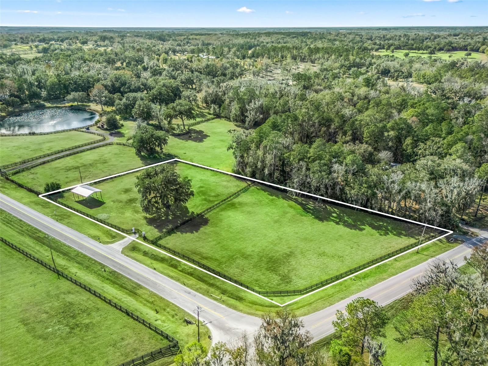 Rare ±3-acre A-1 parcel in the prestigious Golden Corridor along NW Hwy 225a, known as Millionaire’s Row—a perfect opportunity to create your own mini farm. Fully fenced and cross-fenced with four-board fencing and no-climb wire, plus a custom gated entrance with dual electric openers. New 24 x 36 pole barn ready for customization and a new 200-ft well providing ample water. Prime Ocala equestrian location just 12 minutes to the World Equestrian Center.