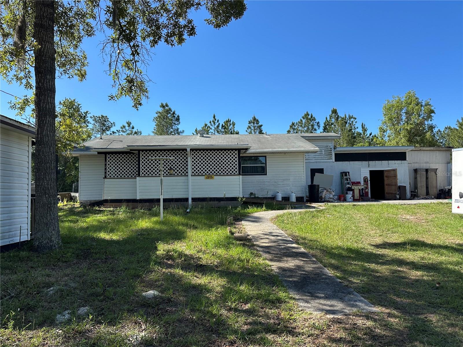 Tucked away at the end of a quiet road just off Turkey Oak, this half-acre property offers privacy, space, and opportunity. Surrounded by natural Florida beauty, this home is ready for a new owner to bring their vision and updates to life. Never Flooded.
Set on a generous ½-acre lot, with room to spread out—both inside and out. The property features a detached shed, a garage/workshop ideal for hobbies or storage, and ample living space within the home. Kitchen is equipped with a gas range. Well and septic already in place, you have the freedom that comes with country-style living.

Enjoy peaceful surroundings with the convenience of being just minutes from the heart of Crystal River, where shopping, dining, and everyday amenities are easily accessible. For boating and outdoor enthusiasts, you’re only 4.6 miles from nearby boat ramps off Ft Island Trail, making it easy to get out on the water and experience the best of Florida’s Nature Coast.
Opportunity for a renovation project, investment, or a private place to call home, this property is full of potential and waiting for your personal touch.