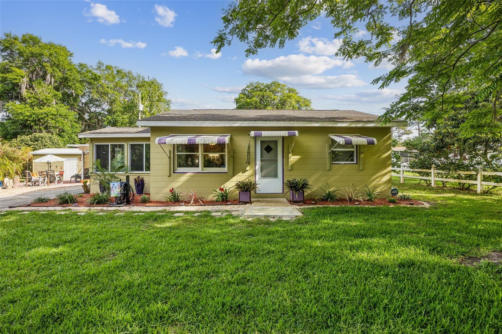 Welcome to River Park West, nestled along the tranquil St. Johns River, offering riverfront living without the hefty waterfront taxes. This charming community combines nature and modern amenities, making it a perfect haven for comfort and adventure seekers. The desirable, updated concrete block home, safely outside flood zones, features two master suites, ideal for privacy-loving families or guests. Situated on a double lot, it provides space for outdoor activities, complete with a custom fire pit and patio for evening gatherings. Enjoy the sunroom/screened porch free from pesky critters or venture out from your deeded boat slip--available through a nominal River Park Boat Club membership--to explore the river & savor fresh catches for dinner. An approx. 24'x 20' detached carport provides cover for your RV or boat and has a 50-amp RV hookup.  Community water and sewer is attached but you also have 2 wells for watering the yard. 2 storage sheds for your tools. 4 Point Inspections provided.