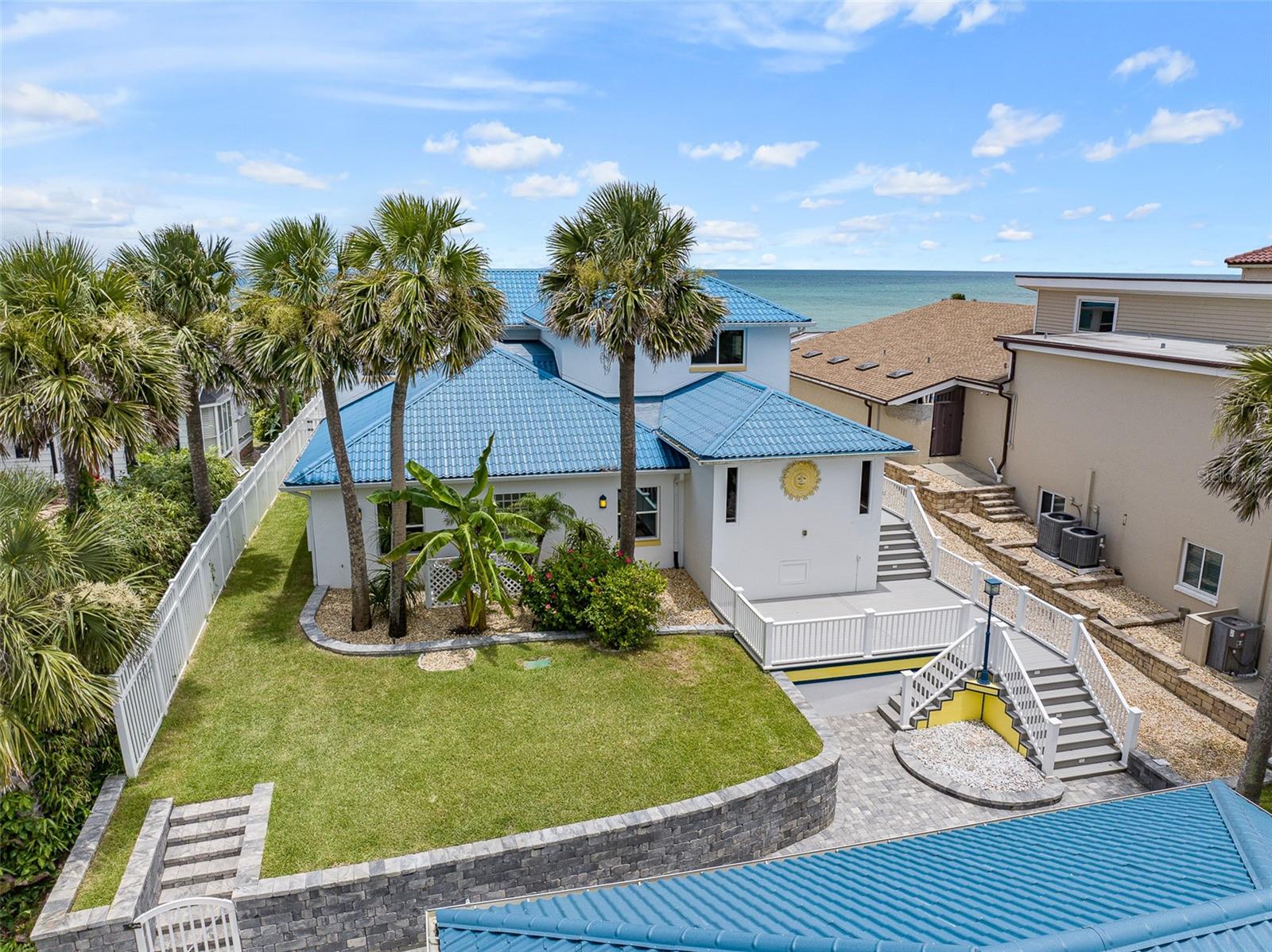 Oceanfront Oasis in the Hearth of Ormond Beach.  Located high on a dune directly across from Oceanside County Club offering endless views of the Atlantic ocean and the pristine NO DRIVE BEACH.  Interior features include 4 or 5 bedrooms (5th bedroom currently used as a media room) 4 full bathrooms with an additional ½ bath poolside.  The primary suite is located on the top floor with private balcony overlooking the pool and ocean.  Pool parties are mandatory around the oceanfront resort style saltwater pool which was constructed to the highest standards utilizing pilings and features fountains and a sun shelf which can accommodate multiple lounge chairs.  The pool deck is imported travertine and accented by a summer kitchen and gas fire pit.  The elevation of this property is evident as you traverse your private beach walkover which extends down 2 tiers to the beach featuring a concrete seawall and coquina riprap on the lower level.    The 3 car detached garage has individual bays and additional storage space.  Some of the updates over the past few years include the GrandeTile energy efficient metal barrel style roof, impact doors and PGT windows throughout, AC units, hot water heater, extensive paver driveway and retaining wall and Kohler 38KW whole home generator with 500 gal buried propane tank.  This home is ready for it’s new owner to put their personal touches on this slice of paradise!!