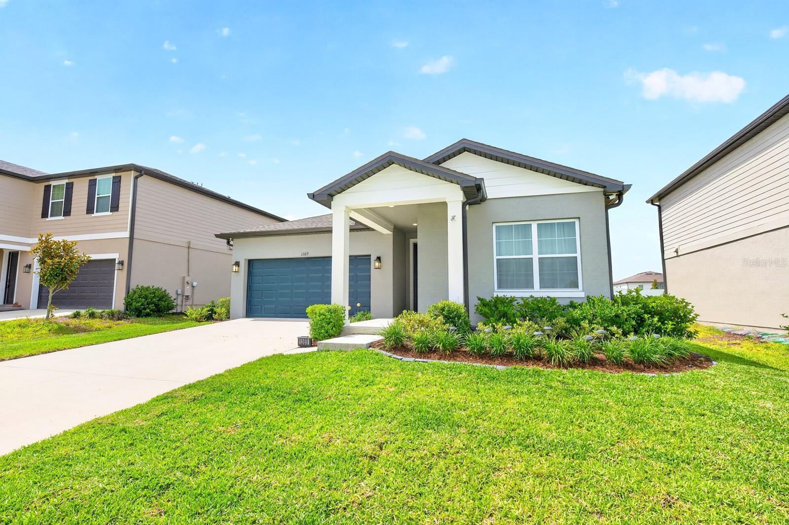 Seller may consider buyer concessions if made in an offer ~ Why wait for new construction when you can have the benefits of a nearly new home right now? BUILT IN 2023 and meticulously maintained, this 3-bedroom, 2-bathroom home in Deltona's desirable Hampton Oaks community offers modern finishes, an OPEN CONCEPT layout, and peaceful views with no rear neighbors. From the moment you arrive, you will appreciate the crisp curb appeal, attractive landscaping, and welcoming presence of this like-new home. Inside, high ceilings and abundant natural light enhance the spacious open living, dining, and kitchen areas, creating a bright and inviting atmosphere ideal for everyday living or entertaining family and friends. Ceramic WOOD LOOK TILE flows throughout the main living spaces, while plush carpeting adds comfort in the bedrooms. The upgraded kitchen is the heart of the home, featuring enhanced STAINLESS STEEL APPLIANCES, ample cabinetry, generous counter space, and seamless connectivity to the living and dining areas. FRENCH DOORS lead to the COVERED LANAI, where you can relax, dine outdoors, or simply enjoy the open green space behind the home with no direct rear neighbors. The thoughtfully designed SPLIT BEDROOM floor plan offers privacy for everyone. The spacious PRIMARY SUITE is ideally situated on one side of the home and overlooks the backyard green space, complete with a well-appointed en-suite bath and an oversized WALK-IN CLOSET. On the opposite side, bedrooms two and three each feature their own walk-in closets and share a full bath. With a LOW HOA, modern construction, and a location that puts shopping, dining, recreation, Lake Monroe, and the Dewey O. Boster Sports Complex within easy reach, this home checks all the boxes. Plus, quick access to I-4 makes commuting to Orlando, Sanford, and the beaches a breeze. Whether you are searching for your first home, a low-maintenance primary residence, or a smart investment opportunity, this MOVE-IN READY Hampton Oaks gem is ready to welcome its next owner. Call today to schedule a tour!