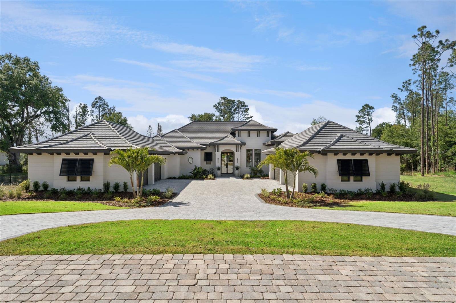 Discover the Savannah, a brand-new single-story residence by Davila Homes, nearing completion in the private gated community of Bella Collina. Designed with an open, flowing layout, this home blends timeless elegance with modern comfort.

The expansive great room connects seamlessly to the chef’s kitchen and dining areas, highlighted by a dramatic tray ceiling in the living room and a drop-down soffit with beams that define the kitchen space with architectural character. The private owner’s suite showcases dual walk-in closets and a spa-inspired bath, both accented with elegant tray ceiling details. Secondary bedrooms each include en-suite baths and generous storage, creating a thoughtful layout for family and guests.

Step outside to a private backyard oasis where a tray-ceiling lanai with wood beams frames the sparkling pool and spa. Additional features include a custom fire pit, low-maintenance artificial turf, and Myra stepping stones that connect the entertaining spaces with beauty and ease.

Set within Bella Collina’s iconic Tuscan-inspired hillsides, residents enjoy world-class amenities including the Sir Nick Faldo–designed championship golf course, resort-style pool, fitness center, tennis, pickleball, dining, and a 75,000-square-foot clubhouse overlooking Lake Siena.

With designer finishes already selected and construction nearing completion, the Savannah model is nearly ready to welcome you home. Schedule your private tour today and experience luxury living in Bella Collina.