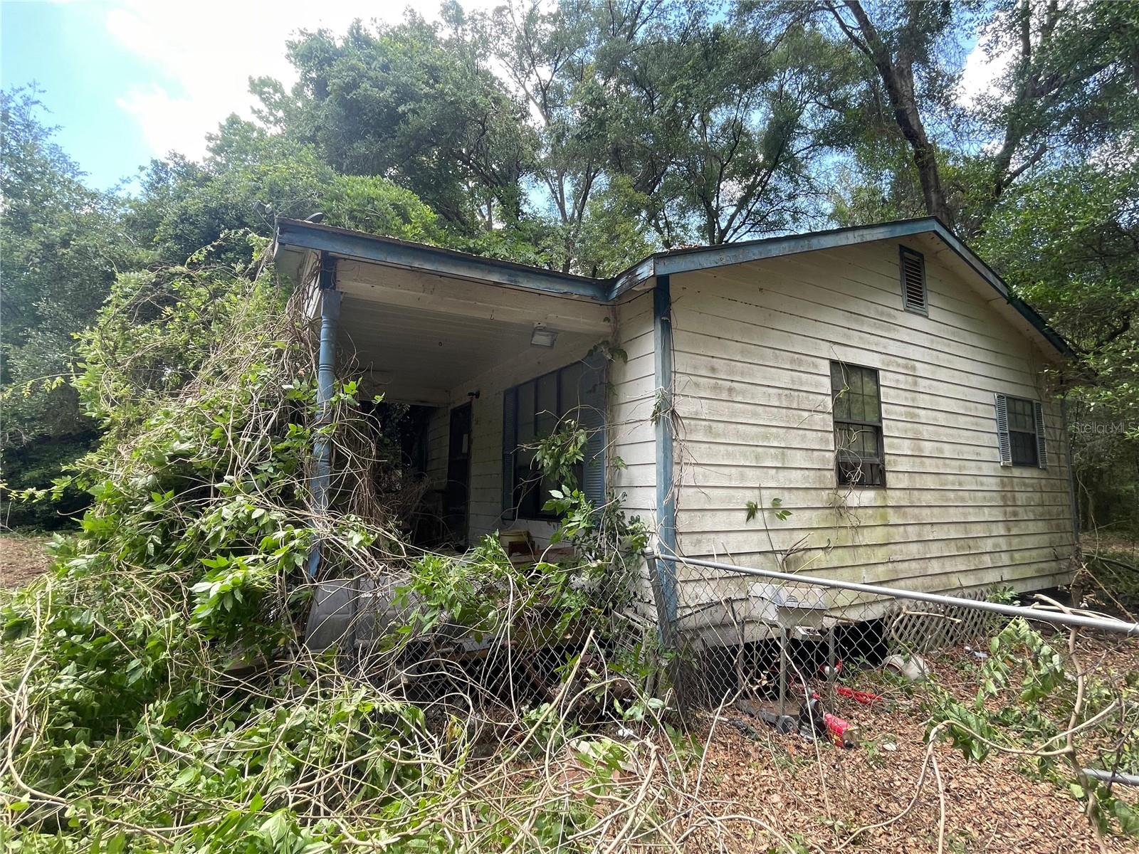 Diamond in the rough opportunity approximately 1 Acre being sold AS IS. Value is in the land, in a desirable area. The property includes 1 single family structure in poor condition and 1 mobile home in poor condition.  No warranties or representations are made regarding the structures. Property is zoned A-1.  With no HOA or Deed restrictions You have the opportunity to create something special.
