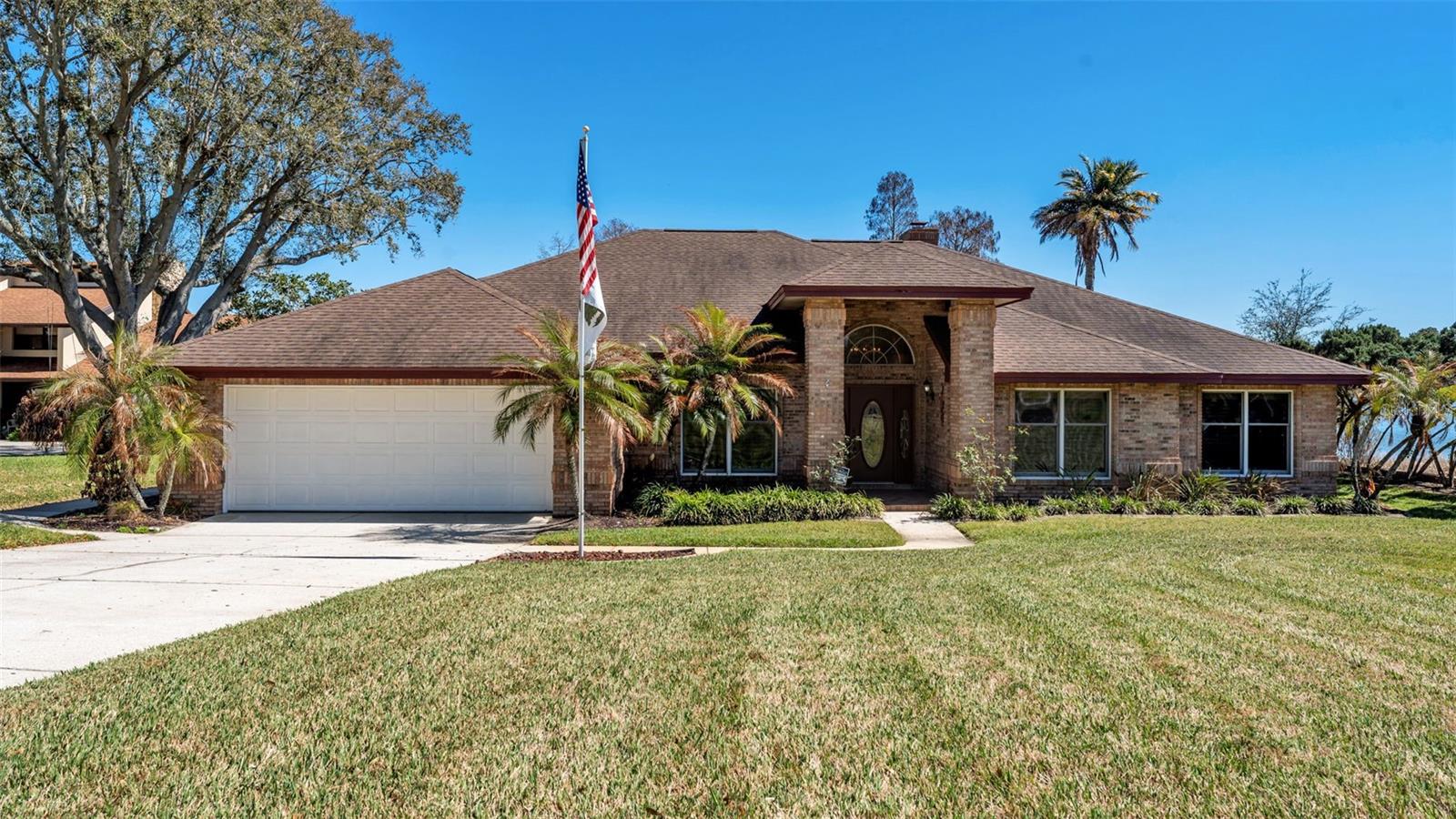 Welcome to this beautiful lakefront home on Lake Juliana, perfectly positioned on a quiet cul-de-sac and set on a generous half-acre lot. This well-built 3-bedroom, 2-bath residence offers peaceful water views, spacious living, and timeless design throughout. Inside, tall ceilings and abundant natural light highlight the open-concept layout. The living room features a striking brick fireplace and French doors that open into the expansive Florida room, creating seamless indoor-outdoor living. A formal dining room provides the perfect setting for gatherings, while the kitchen showcases granite countertops and custom Birchwood cabinetry, which continue throughout the bathrooms for a cohesive, high-quality finish. Additional flex space perfect for your office or 2nd living room. The impressive 46×12 Florida room flows directly into a 35×12 screened porch, offering generous space to relax and entertain while enjoying lake views. Oversized bedrooms provide comfort and flexibility, while the primary suite serves as a private retreat featuring French doors to the Florida room, a 12×7 walk-in closet, Italian marble floors and countertops, a walk-in shower, and an oversized Jacuzzi garden tub. Outdoors, enjoy a beautifully landscaped yard, a large grassy lakefront setting, a fenced portion of the backyard, and your own private dock and boat lift on Lake Juliana — perfect for boating, fishing, and sunset views. Additional highlights include an oversized two-car garage and a large attic area providing excellent storage. This exceptional lakefront property blends space, quality construction, and lifestyle in a highly sought after neighborhood.
