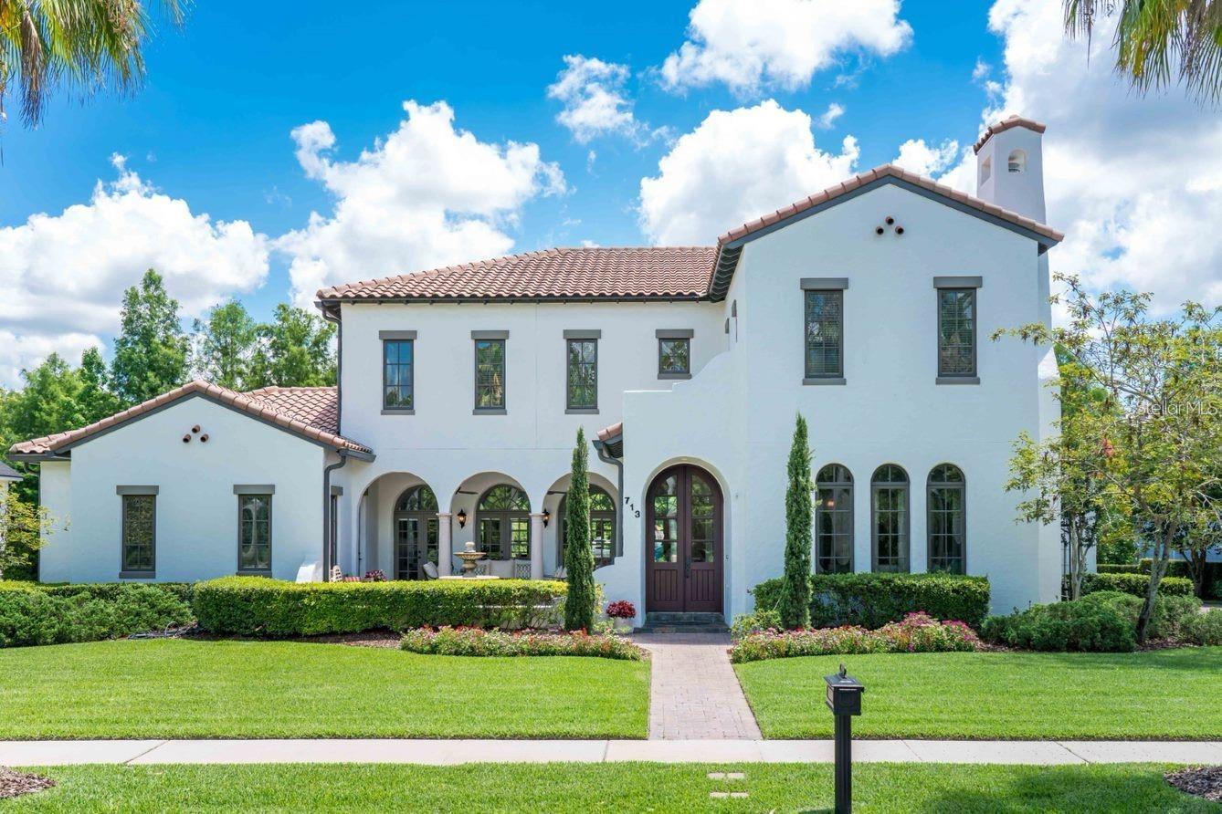 This magnificent custom estate, built by Master Builder Derrick Koger of Derrick Builders, Inc., is set on one of the most desirable lots along the prestigious, palm-lined Eastlawn Drive. Nestled between two ponds and framed by a charming front courtyard, the home offers a picturesque setting and a striking sense of arrival.

Mediterranean architecture defines the residence, with arched doorways and a grand entry that opens into a spacious central living area designed for both everyday comfort and elegant entertaining.

The six-bedroom, six-bathroom layout is ideal for hosting, featuring seamless indoor-outdoor living with covered and open-air dining spaces, as well as a private infinity pool overlooking a serene conservation area.

The first-floor primary suite provides direct access to the pool and includes a spacious bath and oversized closet. An additional first-floor bedroom offers flexibility for guests or multigenerational living.

Upstairs, a loft, three bedrooms, and two full bathrooms create a private retreat. A separate bonus room—accessible via its own stairway—includes a full bath and is perfect for a second primary suite, home theater, or guest quarters, all while capturing stunning views of the surrounding conservation land and rear pond.

  *****   New photography coming mid-May will showcase a series of recent enhancements that further elevate the home’s appeal. The interior has been freshly repainted in a soft white palette, creating a bright, modern feel throughout, while the exterior has also been refreshed. The primary suite now features a beautifully renovated bathroom.

Outdoor living has been thoughtfully upgraded with a redesigned white marble pool deck, accented by turf for a clean, resort-style aesthetic, along with an expanded lower-level paver area ideal for additional lounging, sunbathing, and entertaining. Exterior landscape up lighting enhances the front of the home, while modern wall lighting elevates the pool and entertainment areas.

Additional improvements include full roof maintenance and cleaning, a new 48-inch Monogram stainless steel refrigerator, and enhanced privacy and peace of mind with a newly added perimeter fence and a comprehensive Vivint security system with exterior surveillance.  *****