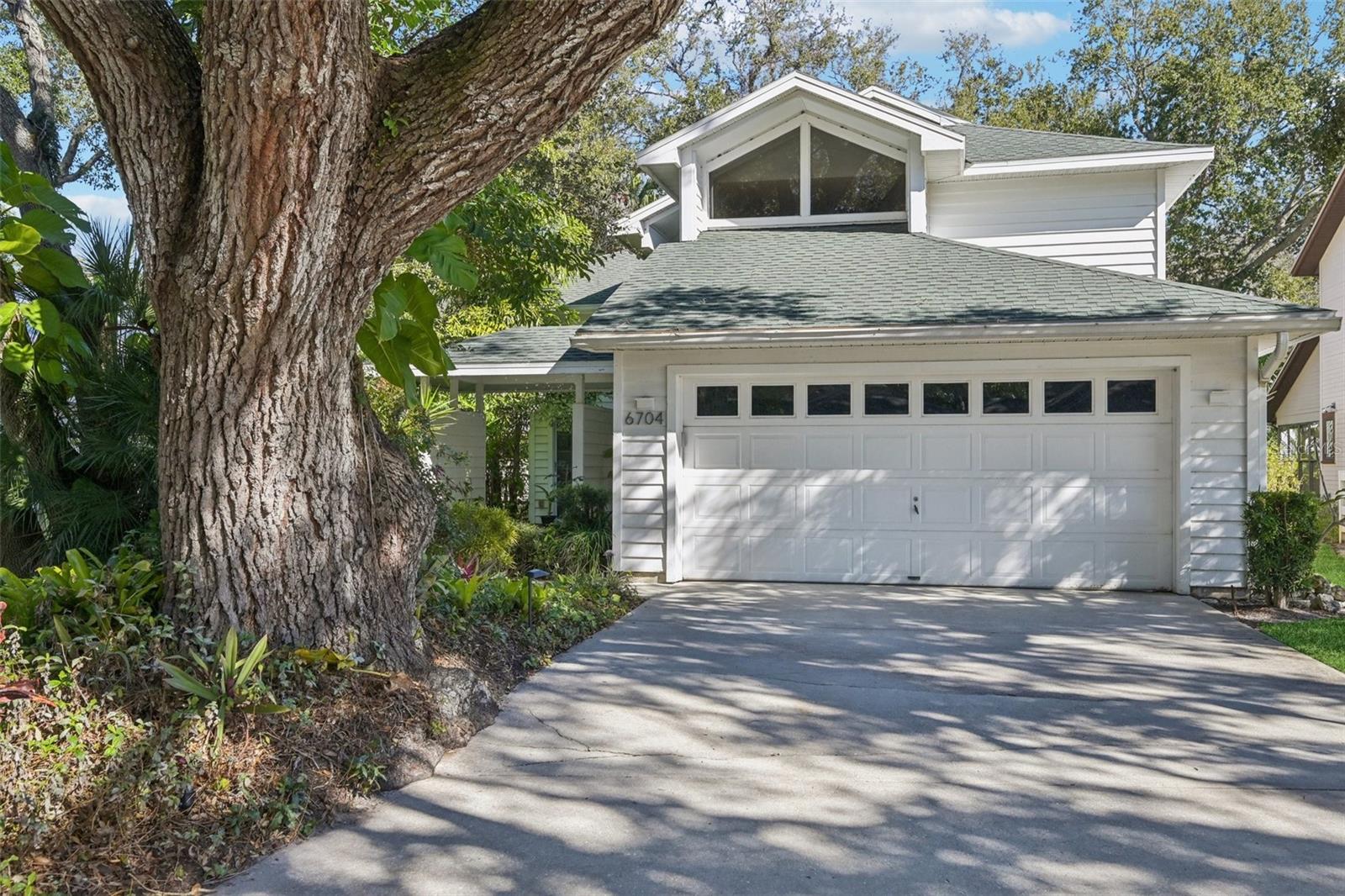 Welcome to 6704 Arbor Oaks Drive, a beautifully maintained 3-bedroom, 2.5-bath home nestled in a peaceful, tree-lined community.

Since purchase, the sellers have completely remodeled the kitchen with quartz countertops, new cabinetry, double ovens, Wi-Fi-enabled electric range, dishwasher, and range hood, creating a functional and inviting space for everyday living and entertaining. The main living area features waterproof luxury vinyl plank flooring, offering both durability and style.

Additional upgrades include two new AC units (2024), new water heater, updated lighting, new garage door system, and a roof replaced in 2017.

Enjoy low-maintenance living with an HOA that includes community pool, Wi-Fi, cable, irrigation, lawn care, and pool maintenance. Conveniently located near GT Bray Park, shopping, and dining, this home offers an ideal balance of comfort, convenience, and Florida lifestyle. Don't miss out on this beautiful move-in ready home- Schedule your private showing today.