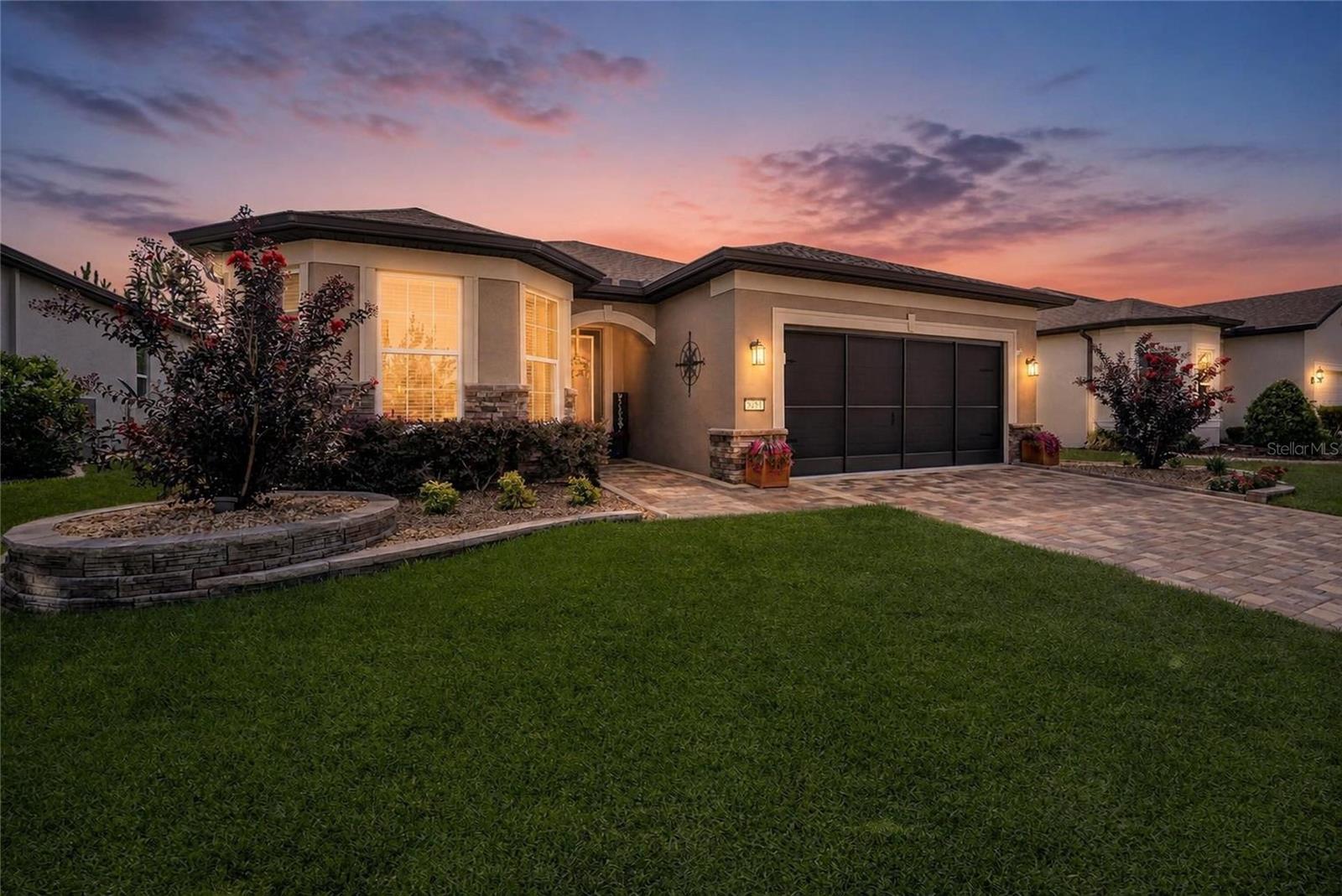 Welcome to this beautifully upgraded Mystique model in the highly sought-after Del Webb Stone Creek, where luxury finishes, thoughtful design, and exceptional outdoor living come together.

This meticulously maintained home offers 2 bedrooms, 2 bathrooms, and a versatile flex room, perfect for a home office, hobby space, or additional guest accommodations. Inside, you'll find luxury vinyl plank flooring throughout the main living areas and bedrooms, complemented by tile flooring in the guest bathroom for easy maintenance and timeless style.

The heart of the home is the gourmet kitchen, featuring quartz countertops, built-in stainless steel appliances, abundant cabinetry, and an open layout ideal for entertaining. The spacious owner's suite is a private retreat, complete with a custom closet organization system and a spa-inspired en-suite bathroom showcasing a zero-entry, tiled walk-in shower.

Designer touches continue throughout with a stunning glass inset front door, a custom barn door leading to the flex room, and numerous upgraded finishes that elevate the home's appeal.

Outdoor living is equally impressive. Relax year-round on the extended screened lanai with an expansive birdcage enclosure, or enjoy the additional paver patio just outside—perfect for grilling, gathering with friends, or taking in the peaceful surroundings. Mature, professionally designed landscaping creates exceptional privacy, while custom upgraded landscaping enhances the home's curb appeal from every angle.

Additional features include an epoxy-coated garage floor, overhead garage storage, and a paver driveway and front entrance that provide both beauty and functionality.

Located in Del Webb Stone Creek, one of Ocala's premier active adult communities, this exceptional home offers the perfect blend of luxury, comfort, and low-maintenance living. With countless upgrades already completed, all that's left to do is move in and enjoy everything this remarkable home and vibrant community have to offer.