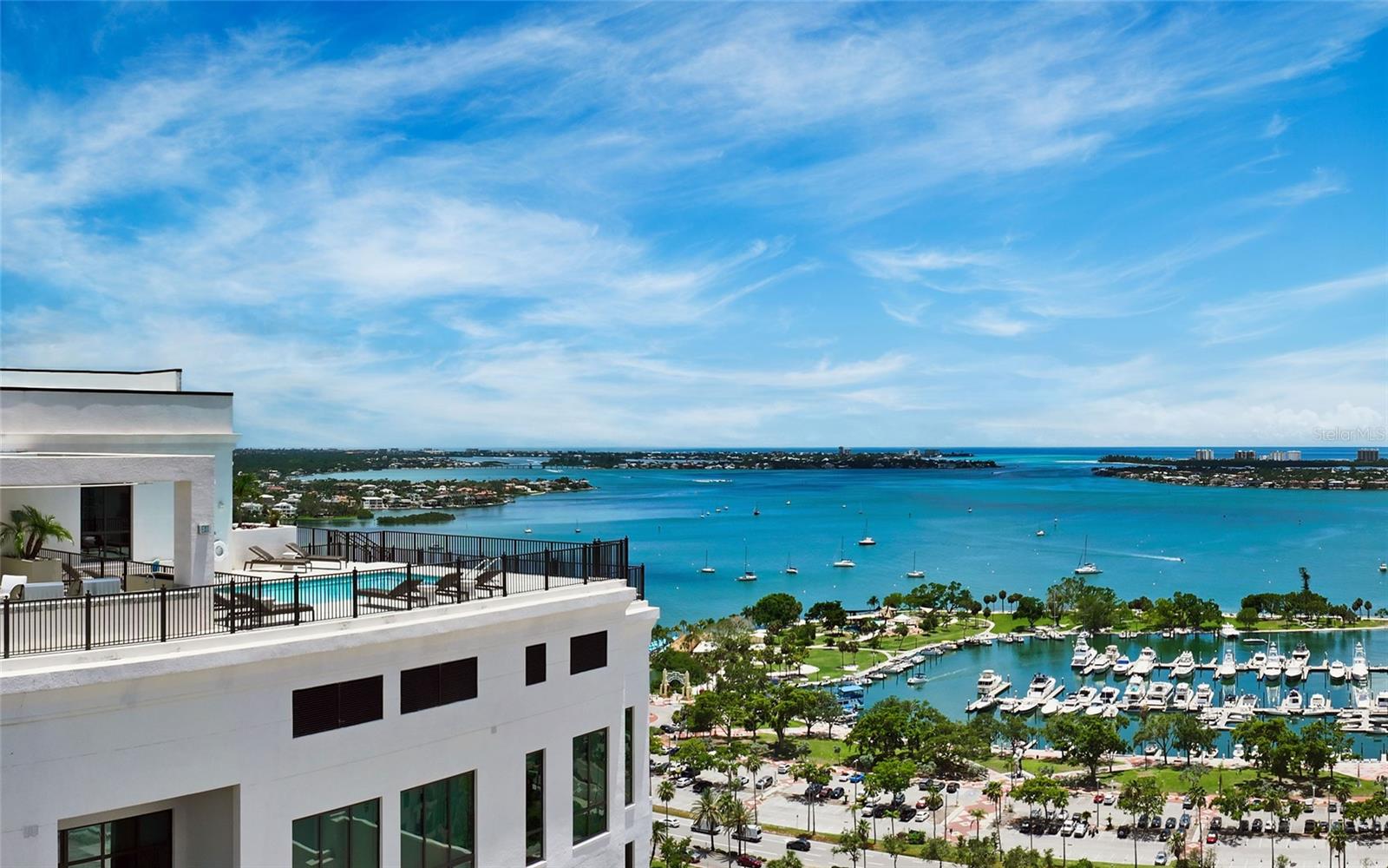 In the heart of Downtown Sarasota, at the coveted corner of Main Street and Palm Avenue, this Penthouse Collection residence on the 15th floor of the newly built DeMarcay rises above the city with sweeping views of downtown, Sarasota Bay, Big Pass, and onward to the Gulf of Mexico. Step outside and walk to art galleries, acclaimed restaurants, boutiques, theaters, the farmers’ market, the city marina, wellness studios and live music. When the beach calls, St. Armands Circle and Lido Beach are just three miles over the Ringling Bridge.

DeMarcay elevates downtown living with resort-style amenities crowned by an 18th-floor bi-level terrace featuring 360-degree vistas. Residents enjoy a state-of-the-art fitness center, an owners’ lounge, outdoor kitchen, and an impressive pool terrace designed for sunset gatherings and entertaining, supported by 24/7 on-site staff for personalized service. This is the only condominium in downtown Sarasota with 24/7 valet parking service, offering a distinctive, space-saving parking configuration and the ease of round-the-clock attended vehicle access.

Bayside on the 15th floor, this 3,407-square-foot residence offers three private bedroom suites, a separate office/den, powder room, open living and dining, laundry, and a private bayfront balcony. Volume ceilings and expansive windows bring in natural light and frame the water-and-sky backdrop throughout. The chef’s kitchen pairs imported Italian cabinetry with quartz countertops, a Miele five-burner gas cooktop, and integrated Miele appliances. The primary suite is a serene retreat with a spa-inspired bath featuring designer Italian cabinetry, porcelain undermount sinks, a soaking tub, and a generous walk-in shower.

An 18-story boutique community of only 39 residences, DeMarcay blends contemporary architecture with Sarasota’s heritage, thoughtfully preserving and restoring the historic facades of the original DeMarcay Hotel (1922) and the Roth Cigar Factory (1923–1938). A rare opportunity to live at Sarasota’s most walkable crossroads—elevated, effortless and distinctly downtown.