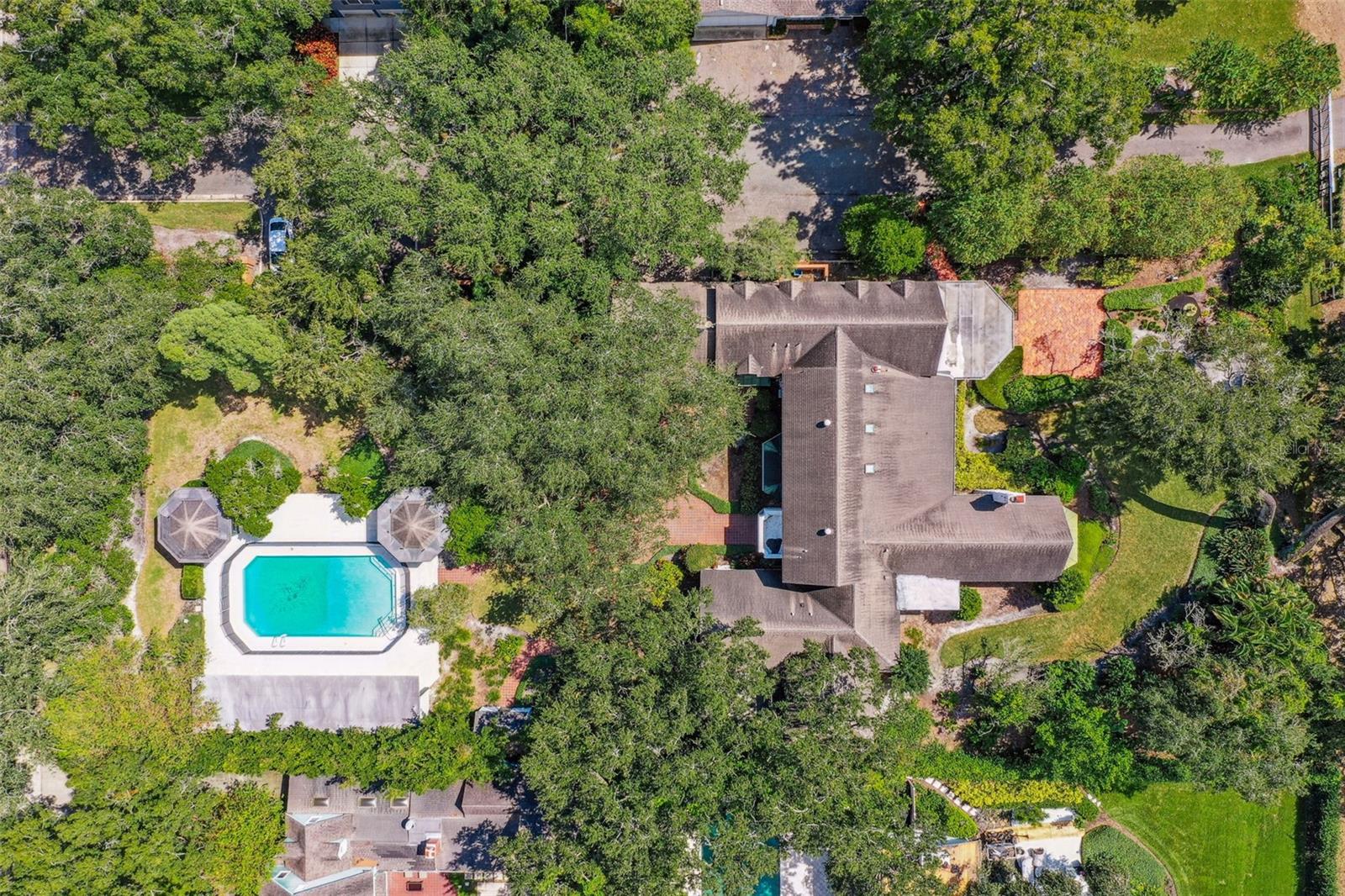 This estate sits on one of the largest lots on Palma Ceia Country Club.  This .83 acre property spans from Morrison all the way to the tee box of the 17th hole.  Available for the first time in over 30 years, this home was extensively updated in 2000 and can be updated again to create a beautiful tudor style home with gracious entertaining and private areas, or can be torn down to create your own masterpiece.  The possibilities are endless.  There is a huge hollywood style pool and poolhouse in the back and a gigantic yard in the front and the back.   A beautiful brick wall surrounds the property.