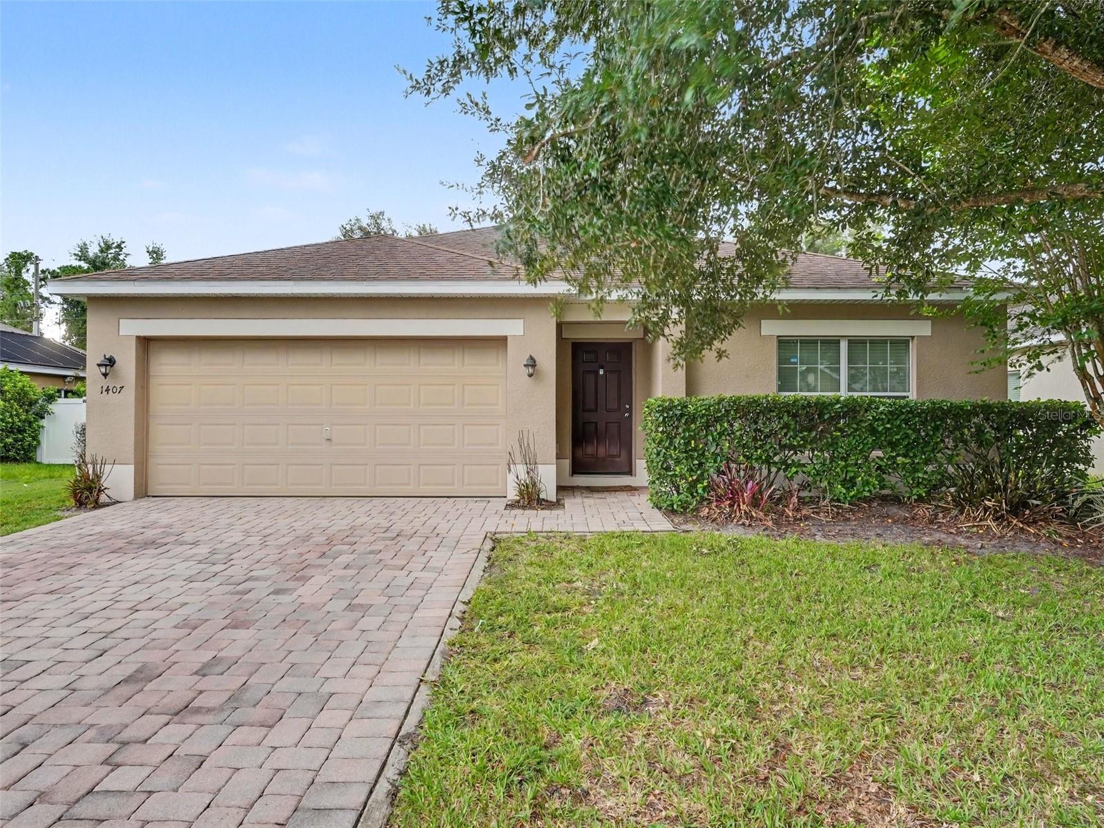 Discover the perfect blend of comfort, style, and convenience in this beautifully maintained home nestled in the sought-after Ashebrook community of Davenport. Thoughtfully designed with an open, split-bedroom layout, this home offers inviting spaces that are ideal for both everyday living and entertaining. Just off the entry, a versatile flex room filled with natural light provides the perfect setting for a home office, reading room, or play space. The heart of the home is the well-appointed kitchen, featuring granite countertops, stainless steel appliances, rich wood cabinetry, a breakfast bar, and a cozy dining area that opens seamlessly to the main living space. The private owner's retreat offers a relaxing escape with a spacious walk-in closet and a spa-inspired ensuite featuring dual vanities, a soaking tub, and a separate walk-in shower. An interior laundry room and attached garage add everyday convenience. Step outside to enjoy Florida living year-round from the covered lanai overlooking a fully fenced backyard complete with mature shade trees and an extended brick paver patio—an ideal setting for weekend barbecues, outdoor dining, or simply unwinding in your own private oasis. Residents of Ashebrook enjoy access to a community park, playground, and scenic walking trails, all while being just minutes from shopping, dining, major roadways, and Central Florida's renowned attractions. This move-in-ready home offers the lifestyle you've been searching for. Click the Virtual Tour link to view the 3D walkthrough. Discounted rate options and no lender fee future refinancing may be available for qualified buyers of this home.