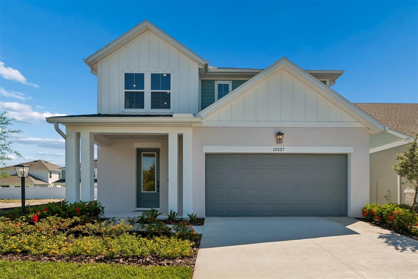 Discover the Zander, aka "The Aqua Atrium," because when you walk into the entry way looking at the kitchen, dinning room and family room, the sunlight from the large windows draws your eyes up to the ceiling almost 20' above you. By David Weekley Homes at Eastlyn in Bradenton, FL, Just ten minutes from I-75 and SR 64 you'll find a two-story home beautifully designed for you, where modern elegance meets everyday functionality. With no CDD Fees and low-HOA, Eastlyn provides a peaceful setting that's close enough to the highway to be convenient, yet far enough away to avoid the big city traffic. Only a 4-minute drive from groceries, 10 minutes to the Costco/Target shopping center where you'll find a variety of stores and top restaurants. Easy access to Sarasota, St. Petersburg, and Tampa allow you to enjoy big city amenities when you want them and the serene relaxation when you don't. This spacious floor plan offers 4 bedrooms, 3.5 bathrooms, 2 car garage and a large upstairs retreat that can serve as a game room, home theater, or quiet reading nook and is backed by David Weekley Homes' comprehensive 1-2-10 warranty. The upgraded gourmet kitchen with electric cooktop and built in oven/microwave combo is a showstopper, featuring quartz countertops, a large walk-in pantry, and seamless flow into the open-concept dining and family areas. Outstanding use of windows and natural light in the atrium style main living area enhances the luxury throughout and adds an elegant feel. The Owner’s Retreat provides a private escape with a spa-inspired Super Shower, and a spacious walk-in closet. The flooring choices throughout are sure to please with durable laminate flooring running through the main living spaces, blending style with practicality and tile in the bathrooms and carpet in the bedrooms. The door to the backyard leads out onto a large covered lanai, extending your space to enjoy the outdoors, perfect for morning coffee or evening conversations under the Florida sky. **This property offers a limited-time interest rate incentive.