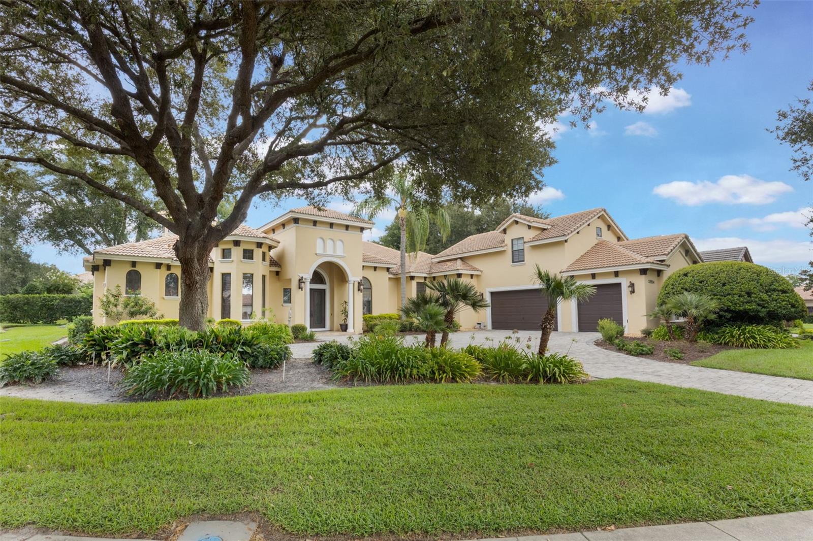 Virtually Staged. Virtually Staged. MOTIVATED SELLER!! - PRICED BELOW APPRAISED VALUE! - Welcome to this custom-built home that reflects exceptional craftsmanship and resort-style living, set within the gated golf community of RedTail. This thoughtfully designed residence showcases real hardwood flooring in formal areas, 8-foot interior doors, plantation shutters, and detailed solid wood trim and crown molding throughout, highlighting the quality of construction. Granite countertops are featured throughout the home. The kitchen being both functional and refined, showcase 42-inch cabinetry, a large center island, stainless steel appliances, a natural stone backsplash, a walk-in pantry, and a separate wet coffee bar. A see-through gas fireplace connects the main living areas, adding warmth and architectural interest. The layout includes a dedicated office or bonus space with built-in shelving and desk, a private home theater. The primary suite serves as a spacious retreat, featuring 12-foot tray ceilings with his-and-hers walk-in closets. Outdoor living features a screened lagoon-style pool with full privacy and a well-equipped outdoor kitchen with granite countertops and a stainless-steel oven, ideal for entertaining. Mature landscaping creates a secluded and serene outdoor setting. RedTail offers championship golf, dining, fitness and spa amenities, Har-Tru clay tennis courts, scenic walking trails, and golf-cart-friendly streets, all conveniently located near downtown Orlando, major highways, and area attractions. Current Insurance $3,563, Taxes $7,706