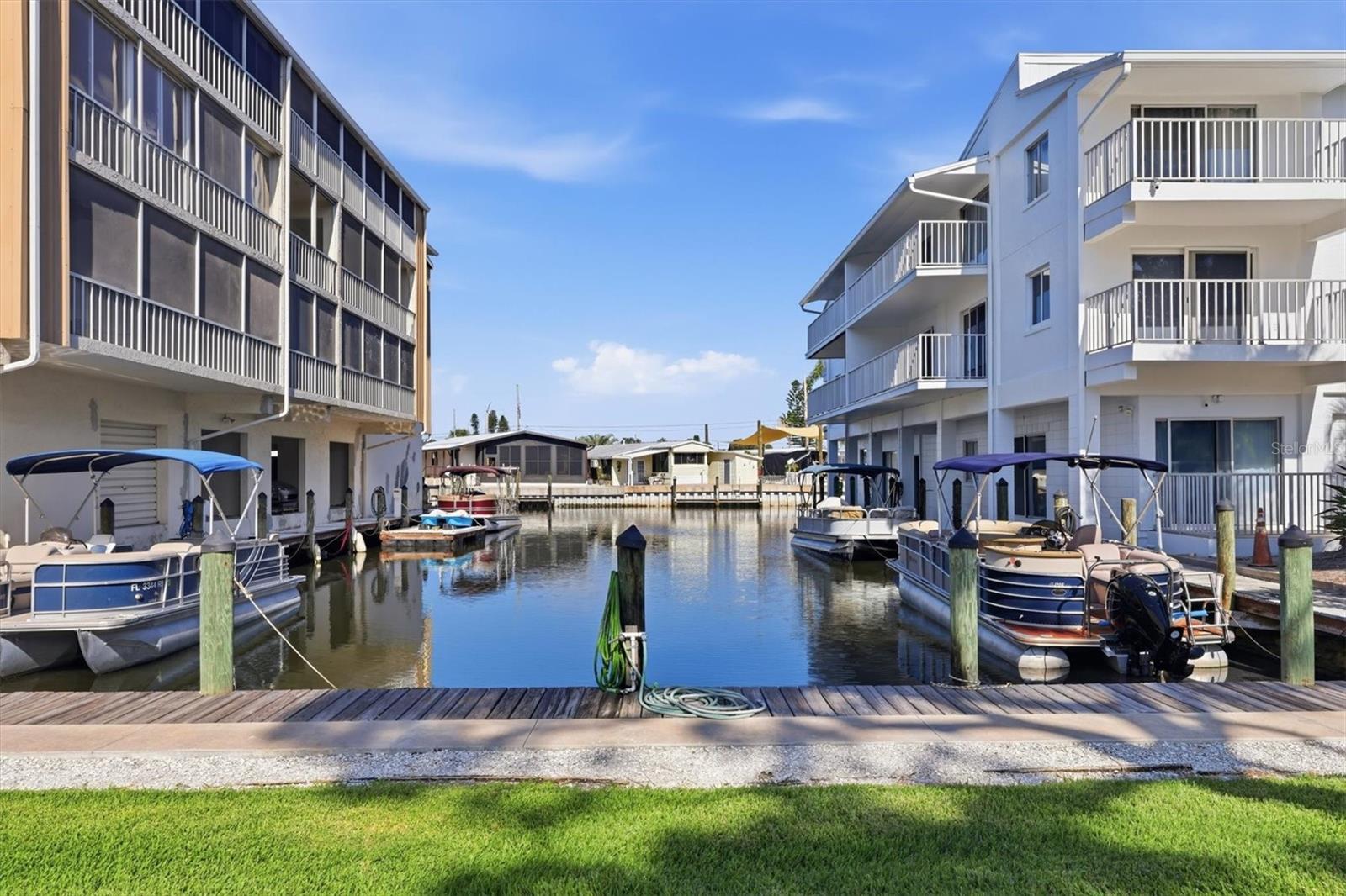 A Boater’s Dream Waterfront Retreat – Turnkey Furnished!
Move right into this beautifully maintained 2-bedroom, 2-bath waterfront condo offered turnkey furnished. The open-concept floor plan seamlessly combines the kitchen, dining, and living areas into one spacious great room, highlighted by stylish gray plank tile flooring throughout.

The spacious primary suite features sliding glass doors leading to the lanai, a large walk-in closet, and an en-suite bath with a walk-in shower. The guest bedroom offers tile flooring, a generous closet, and convenient access to the hall bath with a tub/shower combination.
Builing has new roof, A/C (2022) 

Sarabay Cove offers an exceptional waterfront lifestyle with amenities that include a waterfront clubhouse, heated swimming pool, Jacuzzi spa, two tennis courts, craft room, car wash area, covered parking, bicycle storage, and elevators. Boat docks with water and electric are available to owners for only $2  foot month. The community consists of three buildings connected by picturesque canals, providing quick and easy access to Sarasota Bay within minutes.

Pet-friendly and investor-friendly, this property allows rentals up to 12 times  year with a 30-day minimum lease period.

Ideally located near dining favorites such as Anna Maria Oyster Bar, as well as downtown Sarasota, Lido Beach, shopping, entertainment, and the area's beautiful Gulf Coast beaches. This is the perfect opportunity to enjoy waterfront living, boating, or investment potential in one of Sarasota's most desirable locations.