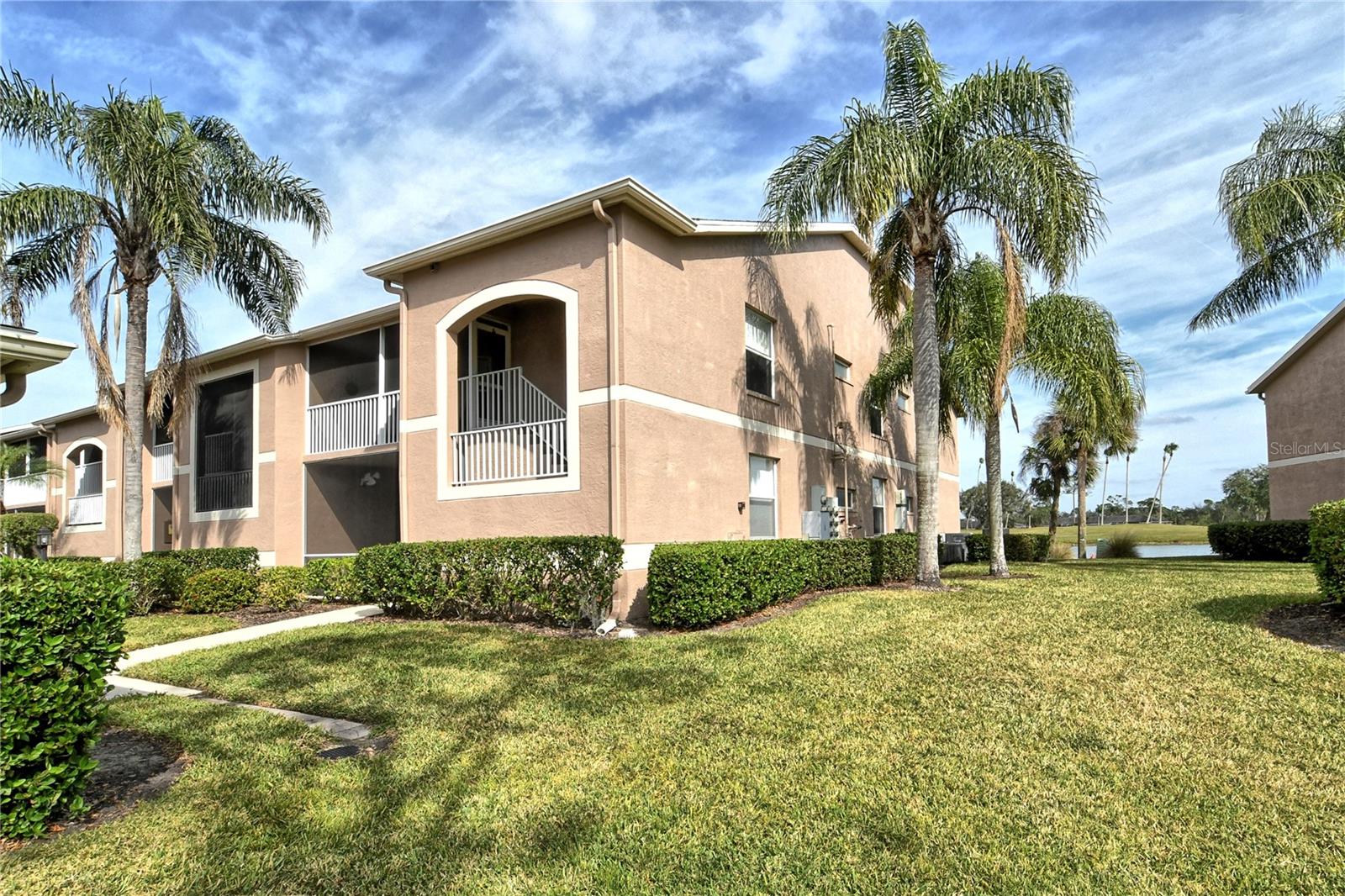 Take a look at this wonderful "Abbey" model Veranda situated within the desirable Heritage Oaks Golf and Country Club in Sarasota, Florida. This delightful 2-bedroom, 2-bathroom residence with a den/study and 1 car garage is designed with both luxury and comfort in a vibrant, nature-filled, private golfing community and is being sold Turn-Key Furnished. Upon entering, you will find a spacious, open-concept living area that invites abundant natural light through generous sliding glass doors, leading to a peaceful tiled lanai where you can unwind and savor the eastern-facing serene views of water and the 13th hole of the golf course. This view is really something spectacular! The well-equipped kitchen boasts modern stainless appliances, ample cabinetry, and stunning granite countertops, making it an inviting space for culinary creativity. The owners have installed beautiful luxury vinyl plank flooring throughout the common areas including the living room, dining room, and the den. The primary suite serves as a private haven, featuring an en-suite bathroom and dual spacious walk-in closets, while the second bedroom offers versatility for guests. The den/study is perfect as a home office or even doubling as a third bedroom as the space features convenient pocket doors giving friends and family additional privacy. Heritage Oaks is known for its pristine 18-hole golf course, har-tru tennis courts, fitness center, 24-hour security, an impressive clubhouse with a lovely restaurant and the sensational 19th Hole Lounge, 5 swimming pools, and a calendar of events packed with activities. Located in proximity to many shopping and dining options as well as the stunning Gulf Coast beaches, this community is a short drive from everything in Sarasota. Make this charming property your new home and enjoy the best of Florida living!
