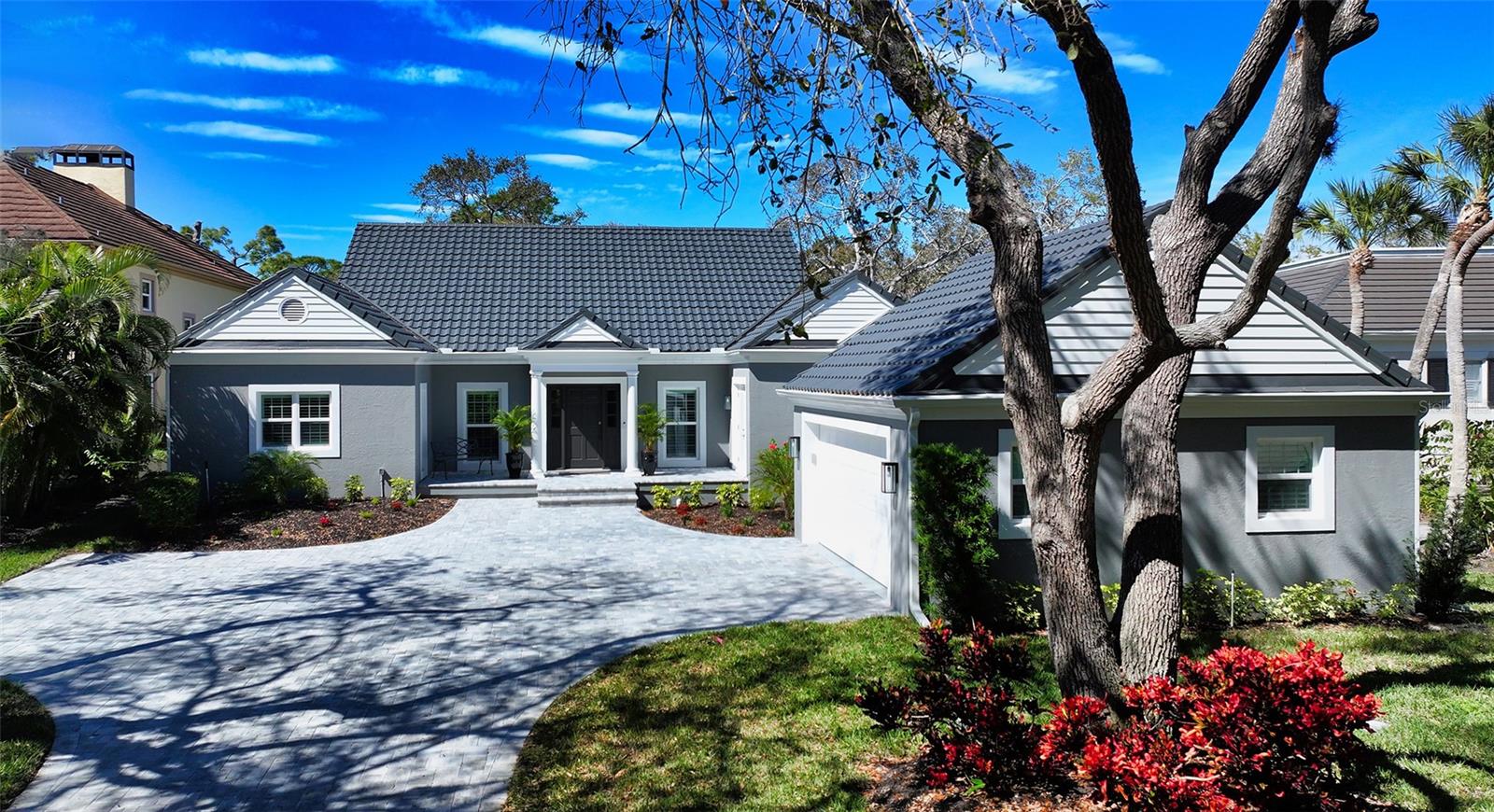Splendid is in the details of this lovely three bedroom, three bath, move in ready home in The Oaks Preserve. No need to be concerned with remodeling, as this wonderful home underwent a total and complete interior and exterior renovation in 2023. This special property meets the demands of today’s discriminating buyer with a spacious chef’s gourmet kitchen featuring top of the line stainless appliances, a large prep island, Cambria quartz countertops, and an open concept for ease in entertaining. 
The family/gathering room is large enough for dual seating areas, and there are three sets of French doors opening to the lanai overlooking the nature preserve. The dining room is adjacent to the kitchen, and there is a separate wet bar for convenience. The primary bedroom features a custom bay window with a built in bench for storage and the large en suite bath has a separate tub and shower, dual vanities and a skylight for natural light. All bedrooms have large windows either overlooking the preserve, or providing natural light, and there are custom plantation shutters throughout. The large newly installed  lanai has brick pavers and there is plenty of room to dine al fresco. Impact resistant high performance windows meet the requirements of today’s insurance companies, and the new roof (2021) meets all codes. The two car garage has a sealed epoxy floor and built ins for plenty of storage. There are numerous additional features if you are looking for a maintenance free home to enjoy for years to come.
Bishops Court in The Oaks Preserve is a 24 hour guard gated community where you can stroll the entire tree lined, canopied neighborhood.  Residents walk and bike ride, and the community pool is across from this home, so no need to worry about maintaining a pool, just swim and enjoy.  The Oaks Preserve also offers many activities by being a member of The Oaks Club, featuring two 18 hole championship golf courses, 12 Har Tru lighted tennis courts, pickleball courts, a croquet lawn, a variety of dining options from casual to gourmet, men’s and women’s clubs, and an abundance of social activities year round. A brand new casual grill room featuring outdoor seating is scheduled to open summer 2024. Membership is required, either social or golf. The Oaks Club is a Platinum Club of America, Emerald Club of the World and Elite Distinguished Club of the World, and is minutes to Sarasota’s award winning beaches, downtown’s cultural arts, and shopping.