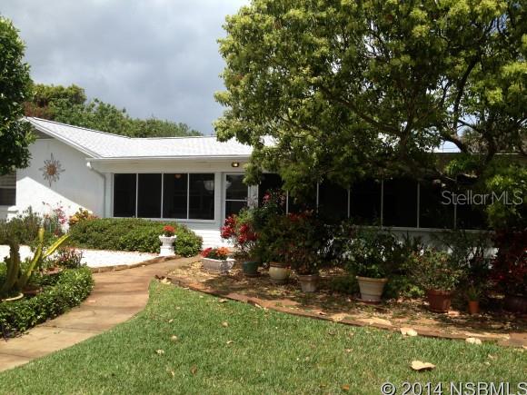 CATCH THE OCEAN BREEZES WHILE SITTING IN YOUR FRONT PORCH 700 FEET FROM THE OCEAN.  4 BEDROOM 2 BATH, THE 2 CAR GARAGE  HAS AN ADDITIONAL  BATHROOM AND LOTS OF STORAGE.   1940 BEACH BUNGALOW FEATURES A 32 FOOT SCREENED IN PORCH, ORIGINAL LARGE CERAMIC TILES, CREATED IN NEW SMYRNA BEACH USED ON PORCH FLOOR, BASE BOARDS, WINDOW SILLS AND BOTH BATHROOM FLOORS.  POSSIBILITY OF SEPARATE MOTHER IN LAW SUITE/ 2 BED ROOM 1 BATH WITH EXTERIOR DOOR.  PERFECT HOUSE FOR FAMILY BUT WITH LOTS OF VERSATILITY FOR GUEST AND MOTHER IN LAW PRIVACY. SEPARATE DINING ROOM, LARGE INSIDE LAUNDRY, OUTSIDE SHOWER, GROUND LEVEL DECK AND LOW MAINTENANCE YARD. UNIQUE FEATURE; ENTIRE EAST SIDE OF EXTERIOR GARAGE WALL HAS A MOSAIC TILE MURAL THAT WAS FEATURED ON HGTV, CREATED BY LOCAL ARTIST BOB HUDGINS. SHORT WALK TO FLAGLER AV TO ENJOY LOCAL RESTAURANTS, SHOPPING AND ENTERTAINMENT. ;Water: City