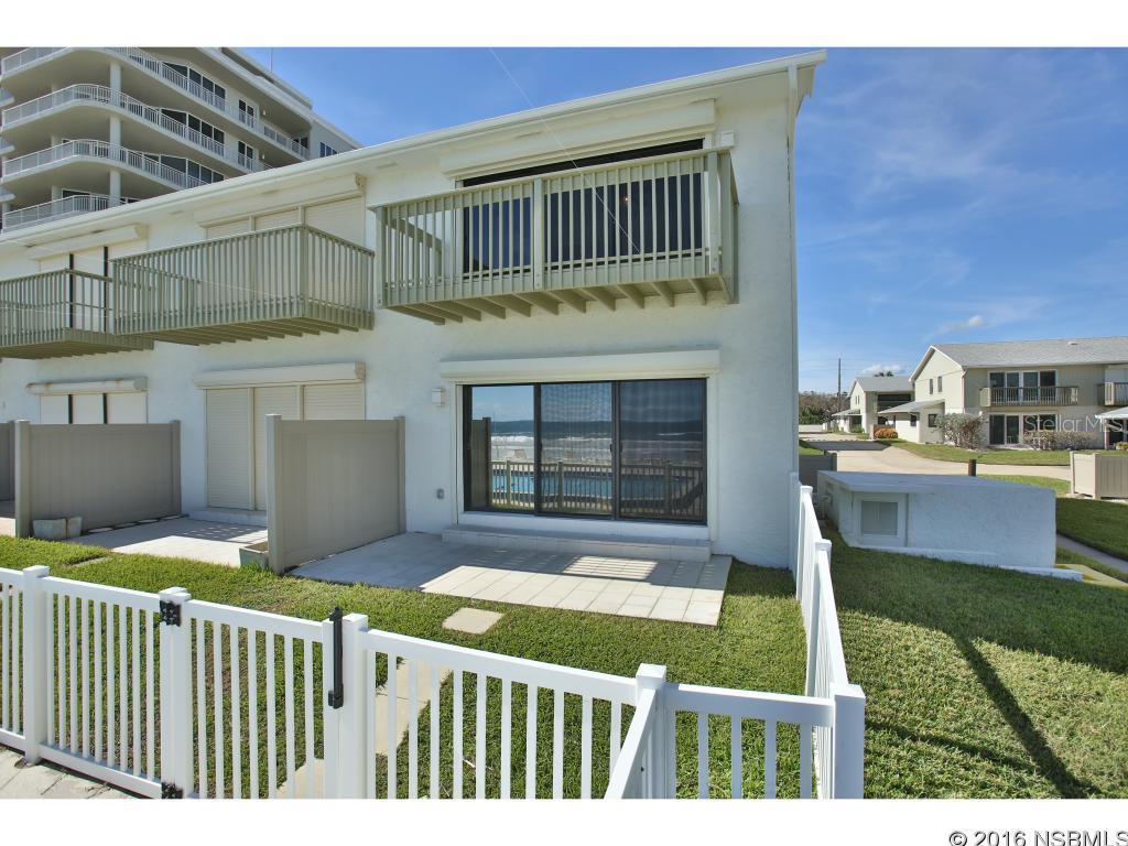 Directly on the beautiful beach!  Oceanfront furnished town home on the no-drive beach.  Attached 1 car garage. perfect to pull up and unload your groceries.   This town home features a multi level architectural layout to take full advantage of our golden sunrises over the ocean horizon.  Easy access to the community pool and beach.Their is a  balcony off the master bedroom overlooking the ocean and pool ,  and a patio off the living room to enjoy morning coffee while watching the sunrises.   All stainless appliances, flat top stove, and bathroom fixtures  replaced 2015, floors, paint and fans new in 2015 and tile throughout.  Full hurricane shutters on ocean side.  Community seawall across entire beachfront and tied off at each end.  Great rental history.  Very clean and sophisticated.  Easy to show. ;Water: City