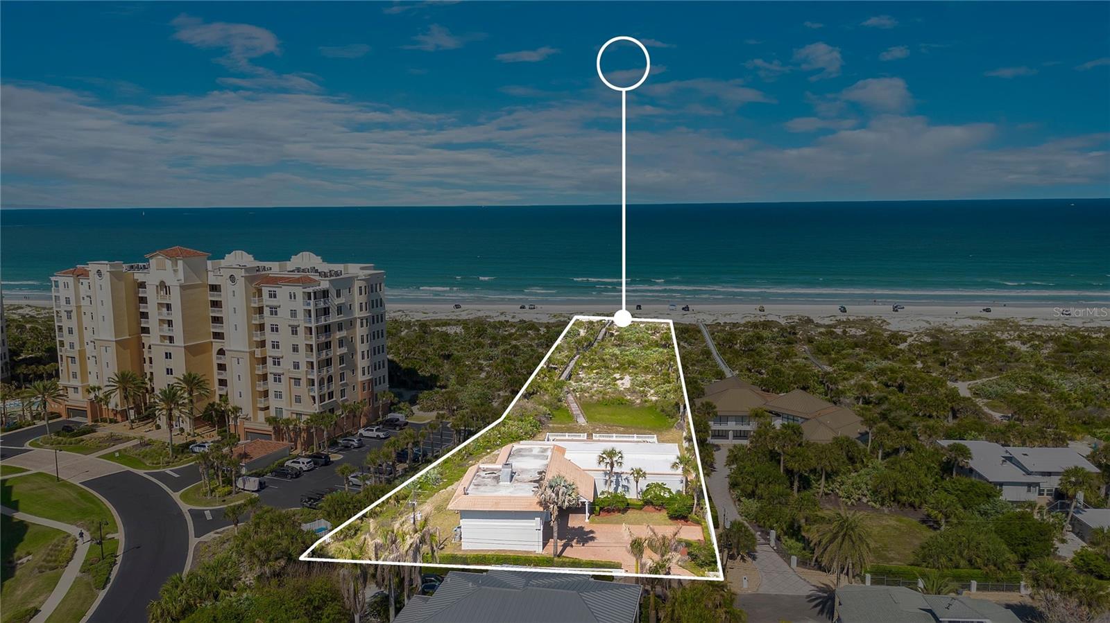 Existing home on the site makes this property eligible for financing. Welcome to your oceanfront experience positioned on 1.5 acres of prime oceanfront land. This presents a rare and valuable opportunity with plenty of land to build or keep the existing estate. This exceptional offering seamlessly blends immediate luxury living with future development potential, making it one of the most versatile and coveted properties in New Smyrna Beach, where you can enjoy the beach while creating your vision for tomorrow. Nestled along the iconic and highly coveted North Beach shoreline, renowned for its world-class surf, this private homesite stretches from Ocean Drive to the sand and surf. As the northernmost single-family oceanfront home before the inlet and dunes park, the property delivers exceptional privacy, panoramic Atlantic Ocean views, and a front-row seat to nature, including sea turtles nesting along the shore. Located in the heart of New Smyrna Beach, known as the surfing capital of Florida, you are just moments from world-class waves near the jetties, fishing at Ponce de Leon Inlet, the lagoon, and a vibrant coastal lifestyle filled with waterfront dining, boutique shopping, and local art. Whether you are building expanding, investing, or simply enjoying oceanfront living at its finest, this rare gem of a property offers a truly unmatched opportunity with NO HOA.