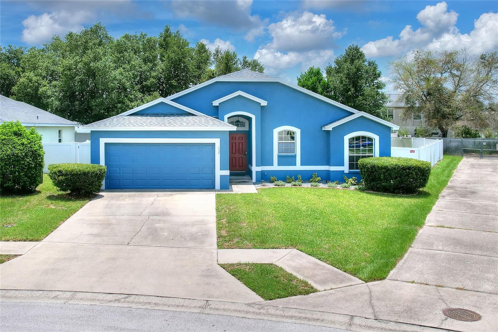 LOCATION!!  Catch it while you can!  This lovely 3/2/2residence is available NOW!  With a new roof, water filtration system, fenced yard, and no carpet, recent exterior paint, this is prepared for your active daily lifestyle.  Located close to Legoland, Highway 27, Publix, and more, this central Florida location is home to outdoor water sports, golf, and more!  This home sits on a spacious, fenced lot, which offer privacy and safety for pets.  The floor plan is spacious, with great room separating the accessory rooms providing privacy for restful times.  The indoor laundry is conveniently located just inside from the garage entry.  The owners suite will delight, with ample closet space and comfortably equipped en suite featuring soaking tub, separate shower, & private water closet.  Recent updates include new roof, water filtration system, exterior paint.  Sold AS IS for seller convenience.