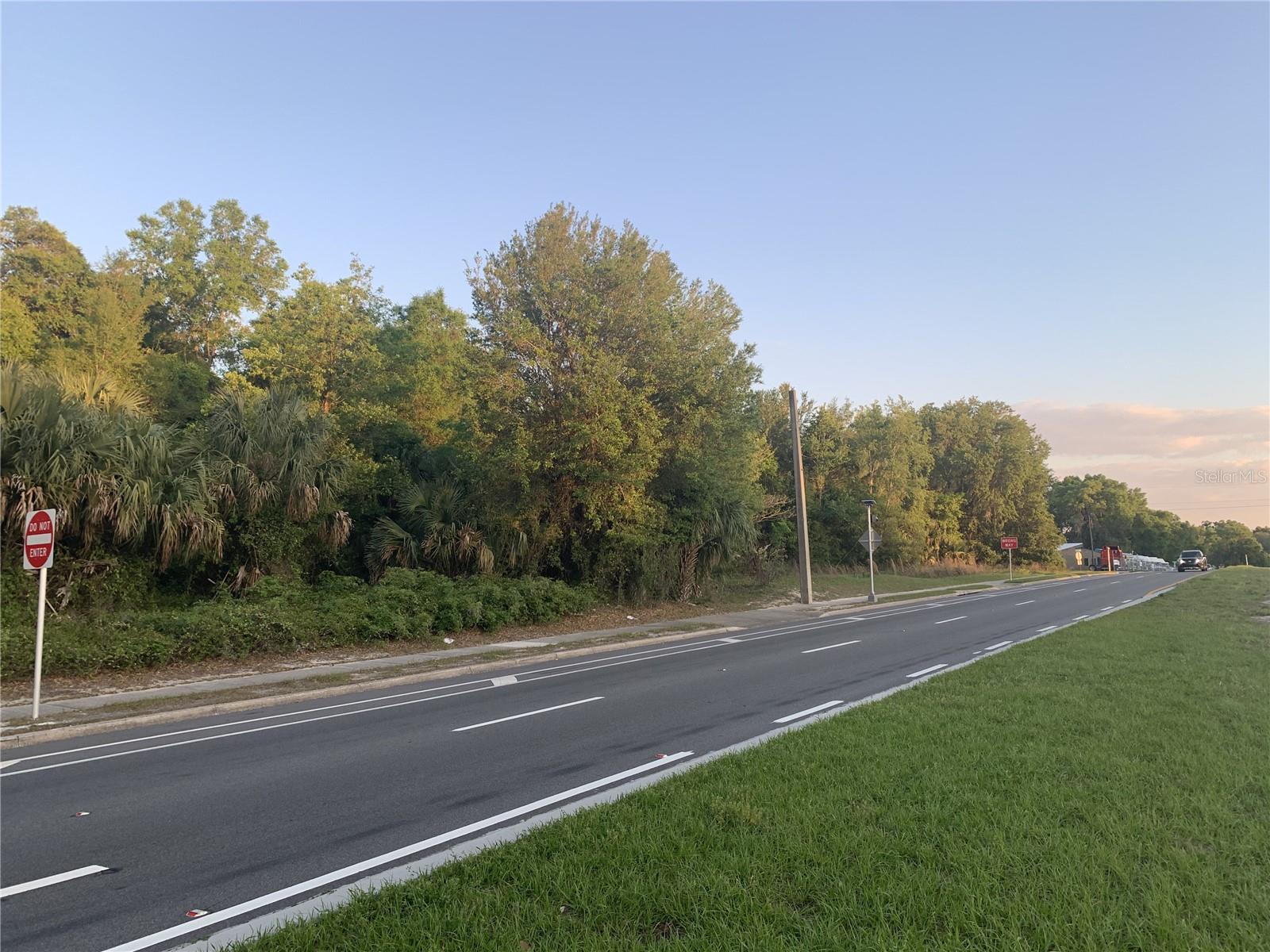Prime 3 acre B-5 commercial parcel located at 18111 US Highway 301 in Citra, Florida. Property features direct frontage on US Highway 301 with strong visibility and consistent traffic flow along the corridor between Ocala and Gainesville. The site is level, usable, and spans approximately one city block. Located across from a local fire station, providing an easy-to-identify landmark. B-5 zoning allows for a variety of commercial uses including retail, automotive sales, mini warehouse or storage, and service-related businesses. Buyer to verify all intended uses, zoning, and development requirements with Marion County. Marion County records indicate two situs addresses associated with this parcel, including 2291 NE 180th Street. This may provide additional access or reference points. Buyer to verify all information with Marion County.