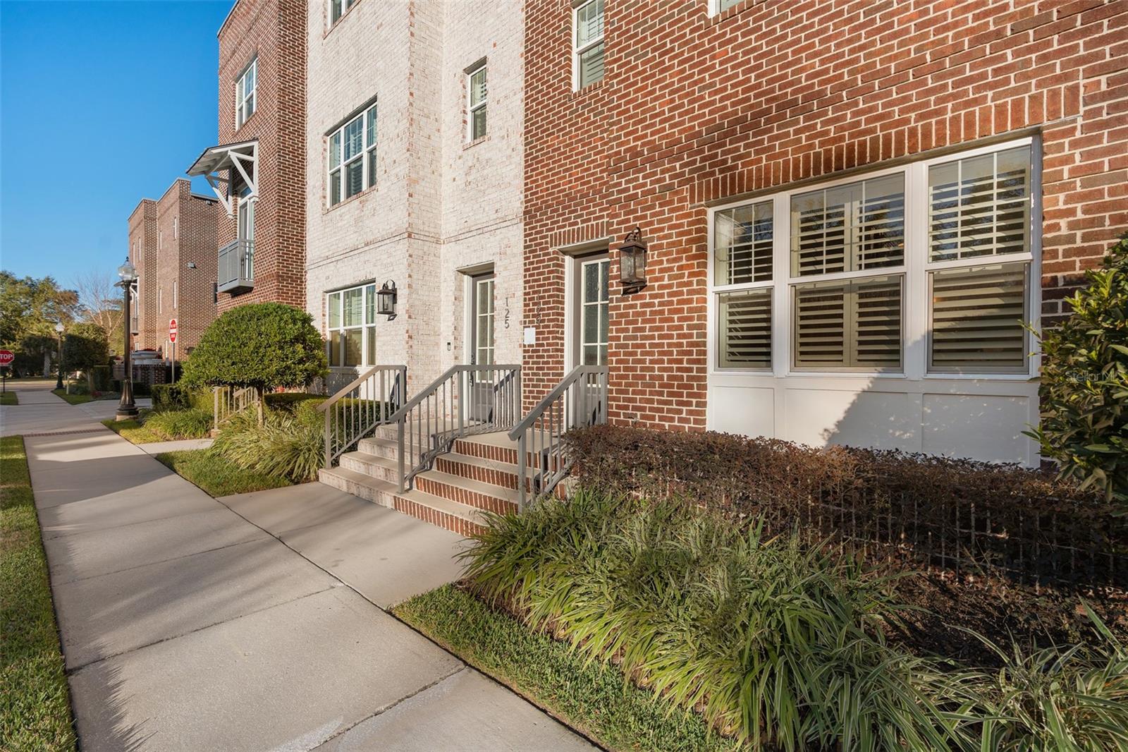 Welcome Urbanists to this modern and sleek three-story townhome at Park Place, located in the heart of Downtown Winter Garden Historic District. Fully Furnished and Turn Key ready, unit offers 2,030 square feet of thoughtfully designed living space and this well-maintained home features 3 bedrooms, 3.5 bathrooms, and a Custom Elevator providing convenient access to every level. The first floor includes a private guest suite, which would make a perfect mother in law space with a full en-suite bathroom and easy entry. The second floor showcases an open-concept living area with a spacious dining room, rear balcony, and a chef-inspired kitchen complete with an oversized island, breakfast bar, wood cabinetry, stainless steel appliances, a gas range, and ample counter space. The top floor is dedicated to the private primary suite, featuring a spa-like bathroom with dual vanities, a soaking tub, and a large walk-in shower. Additional highlights include natural gas, ceramic flooring, plantation shutters, tankless water heater and a rear-entry two-car garage. Ideally situated just steps from ever changing Plant Street, the Plant Street Market, Crooked Can Brewing Company, and the West Orange Trail, this home offers an exceptional walkable lifestyle with easy access to shopping, dining, entertainment, community events, major highways, and Orlando's top attractions.