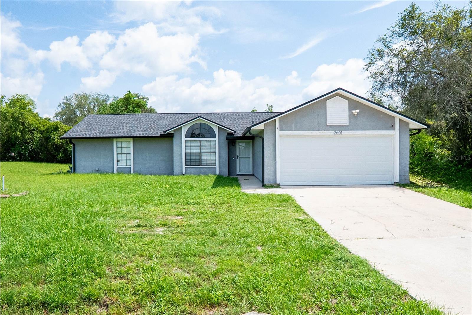 Opportunity awaits at 2601 Lake Helen Osteen Road in Deltona! Priced to sell at just $275,000, this 3-bedroom, 2-bathroom home sits on a spacious corner lot with no HOA, offering flexibility and room to make it your own. A small wooded area beside the property provides added privacy, while the oversized driveway offers plenty of parking for multiple vehicles, boats, trailers, or recreational equipment.

Inside, you'll find a functional layout with open living spaces, a generously sized kitchen, and excellent potential for customization. The home has room for cosmetic updates, making it an ideal opportunity for buyers looking to build equity, first-time homebuyers, investors, or anyone seeking an affordable home with room for improvement.

Conveniently located near I-4 and SR-417, this property offers easy access to Orlando, Sanford, Lake Mary, and surrounding areas. Enjoy nearby parks, nature trails, camping, shopping, dining, and everyday conveniences.

If you've been searching for an affordable home in Deltona with no HOA and strong upside potential, this property deserves a look. Schedule your private showing today.