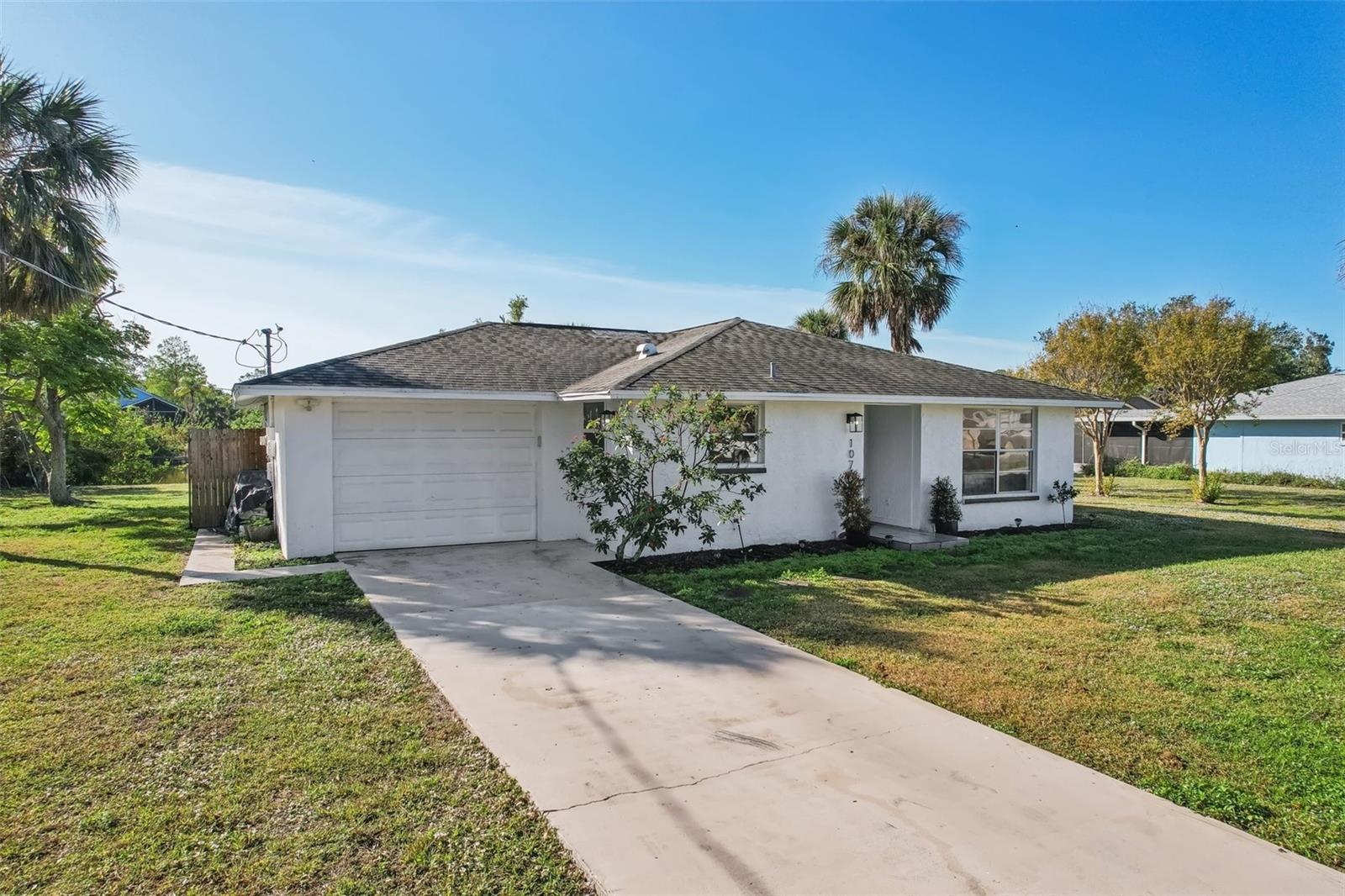 This cute, updated 2-bed, 2-bath home sits on a quiet .22-acre lot with a lake view and plenty of room for a pool. There are no HOA or CDD fees. BRAND NEW ROOF installed in June 2026. The interior received an extensive remodel in 2023 including new kitchen appliances, luxury vinyl flooring, fresh paint inside and out, modern shower tile and granite counters in both the kitchen and master bath, and screened back porch. Plumbing and electric systems are both in excellent condition. You're on a well so no water bill, plus a new water softener installed in 2023. You’ll be at Manasota Key Beach in just 5 minutes. W/D included with purchase. Target, Publix, Walmart, Home Depot, Manasota Beach, ample shopping and dining all within a 5-minute drive.