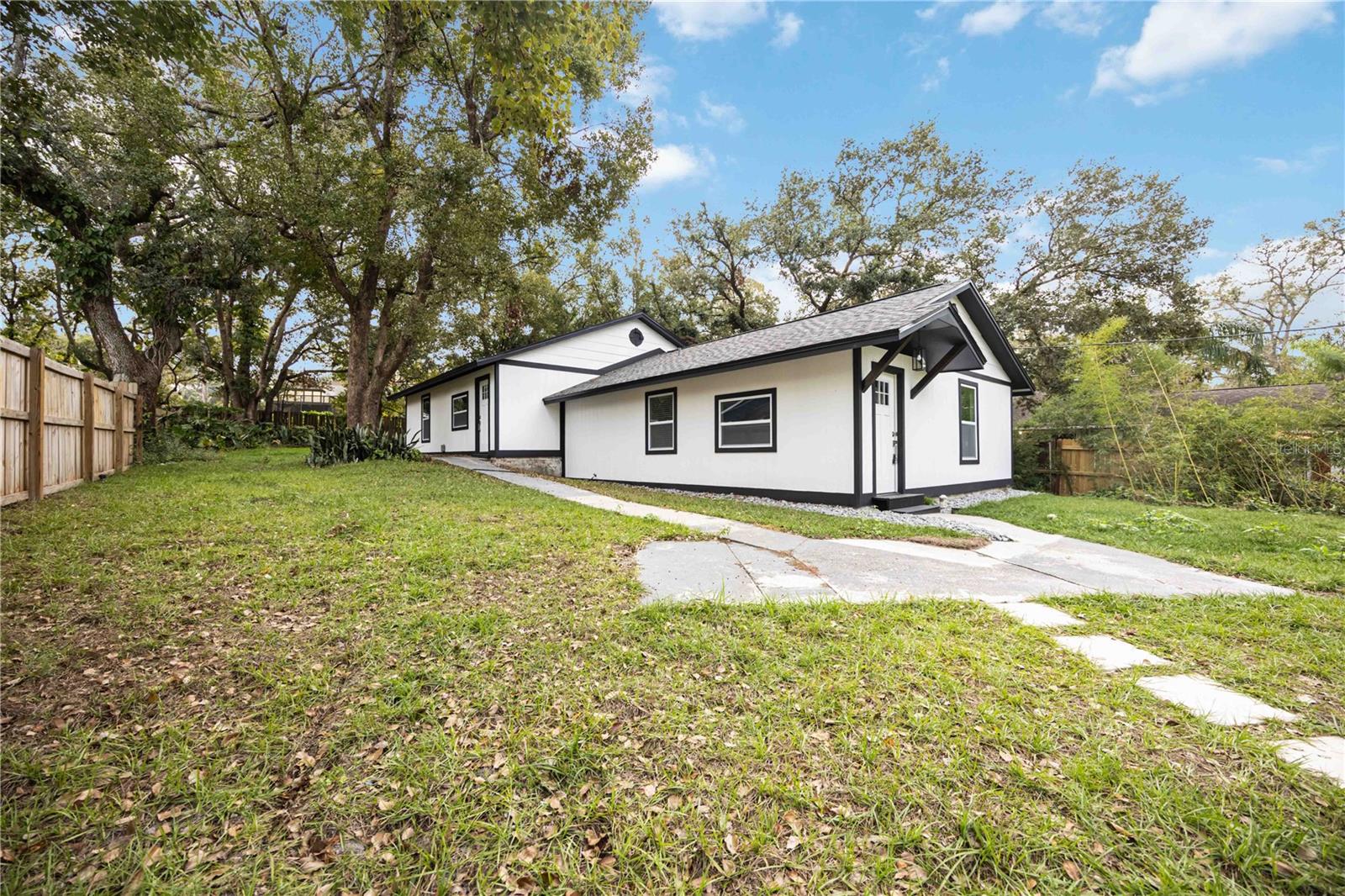 Completely renovated, this stylish 2-bedroom, 1-bath residence is move-in ready. The updated kitchen features brand-new stainless steel appliances, warm butcher block countertops, and modern cabinetry. Ceramic tile flooring throughout offers a clean, low-maintenance living space, while ceiling fans add everyday comfort. Conveniently located near shopping, dining, major roadways, and with quick access to I-4 and I-75, this home combines modern finishes with an ideal location. A great rental opportunity at an exceptional value.