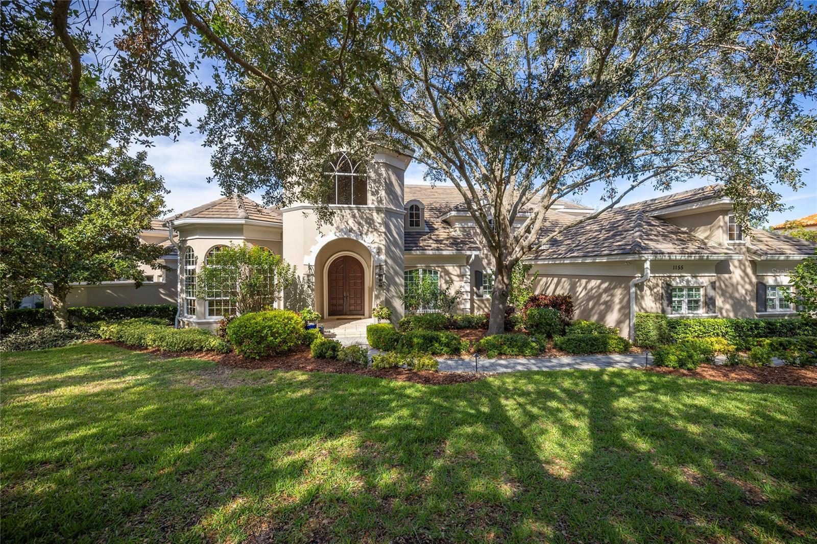 Unparalleled recreational amenities define this home overlooking the Osprey Golf Course at  Innisbrook Golf Resort. Enjoy views of forever green fairways and postcard sunsets while entertaining guests by the infinity-edge pool and spa.  NOT in a flood zone. The impressive theater/game room houses a glass front wine cellar, holding approximately 1500 bottles of wine. This 5 bedroom, 4 full baths, 1 half bath plus office home boasts a new kitchen in 2022 and a new roof in 2020. The 5th bedroom/second office is on the first floor with a small closet. Set on a half acre lot, this home looks majestic. The grand foyer steps down to the casual elegance of the living room and dining room with Butler’s Pantry. The new island kitchen with white cabinets, stone countertops, Wolf gas cooktop, Wolf double ovens, and Sub Zero refrigerator will make cooking a joy. The kitchen opens to the breakfast dining and family room. Tray ceilings, crown molding, tumbled marble floors, and plantation shutters adorn this home. The first-floor primary suite boasts a sitting area, two private bathrooms, two large walk-in closets, a shared shower, and a private outdoor heated spa. The 10-seat theater with 2021 cinema system including a cocktail bar, poker table, wet bar, and glass front full wall wine cellar is a winning combination. On the second floor, there are 3 guest bedrooms with walk-in closets. Central vacuum. Designed with space for an elevator to be added. The salt-chlorinated, heated infinity pool with spillover spa was renovated in 2021. The outdoor kitchen is complete with gas grill, fireplace, beverage refrigerator, and is framed in stonework with a milled-work ceiling. New sprinkler system in 2021 with reclaimed water for irrigation, and landscape refresh. Insta-heat water heater 2021 and Culligan water system. Side load three car garage. Discounted full golf membership available to buyer. Social membership to Innisbrook Golf Resort is required ($1,541) including use of the Loch Ness resort pool with waterslides, additional heated pools, fitness center, golf driving range, and access to a full-service spa.  Additional memberships available for tennis, pickleball, golf courses, and racquetball. Minutes to beautiful  beaches. Community is across the street from the 45 mile Pinellas biking/walking trail and Wall Springs Park. Location! Location!