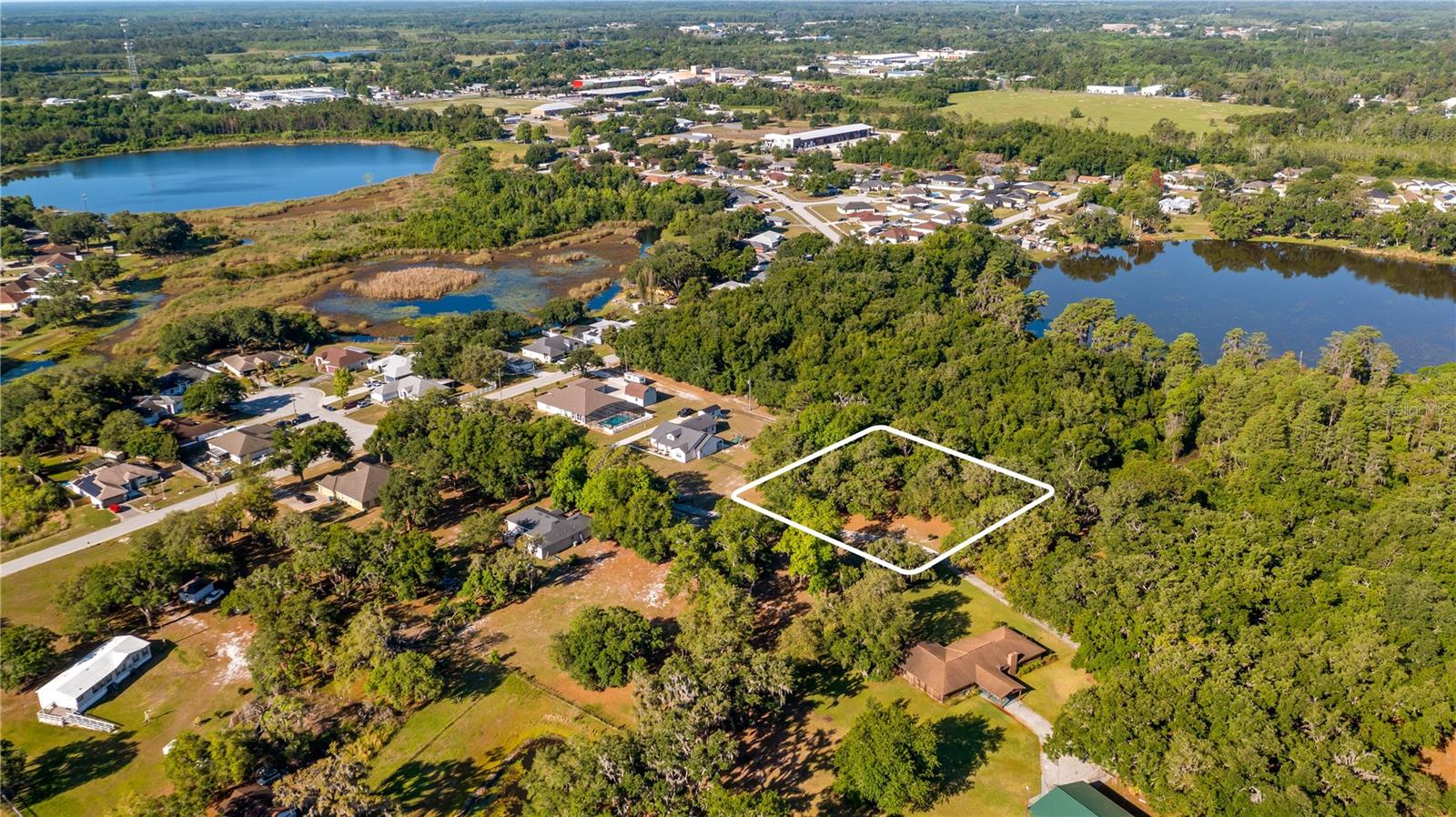 Discover the perfect blend of privacy and convenience with this beautiful lot, ideally located close to town yet tucked away enough to enjoy a serene, country-like setting. The property is graced with stunning, mature oak trees that provide natural shade and timeless charm—creating an ideal backdrop for your future home. With no required time frame to build, you can secure your piece of land now and build when you’re ready. Bring your own builder and design the home that fits your vision and lifestyle. Best of all, NO HOA means true freedom—bring your boats, RVs, trailers, and all your toys without restrictions. Whether you’re looking to build now or invest for the future, this rare property offers flexibility, beauty, and location all in one. Don’t miss this opportunity to own your own slice of country paradise with city convenience! Lot 3 is available for sale across the street.