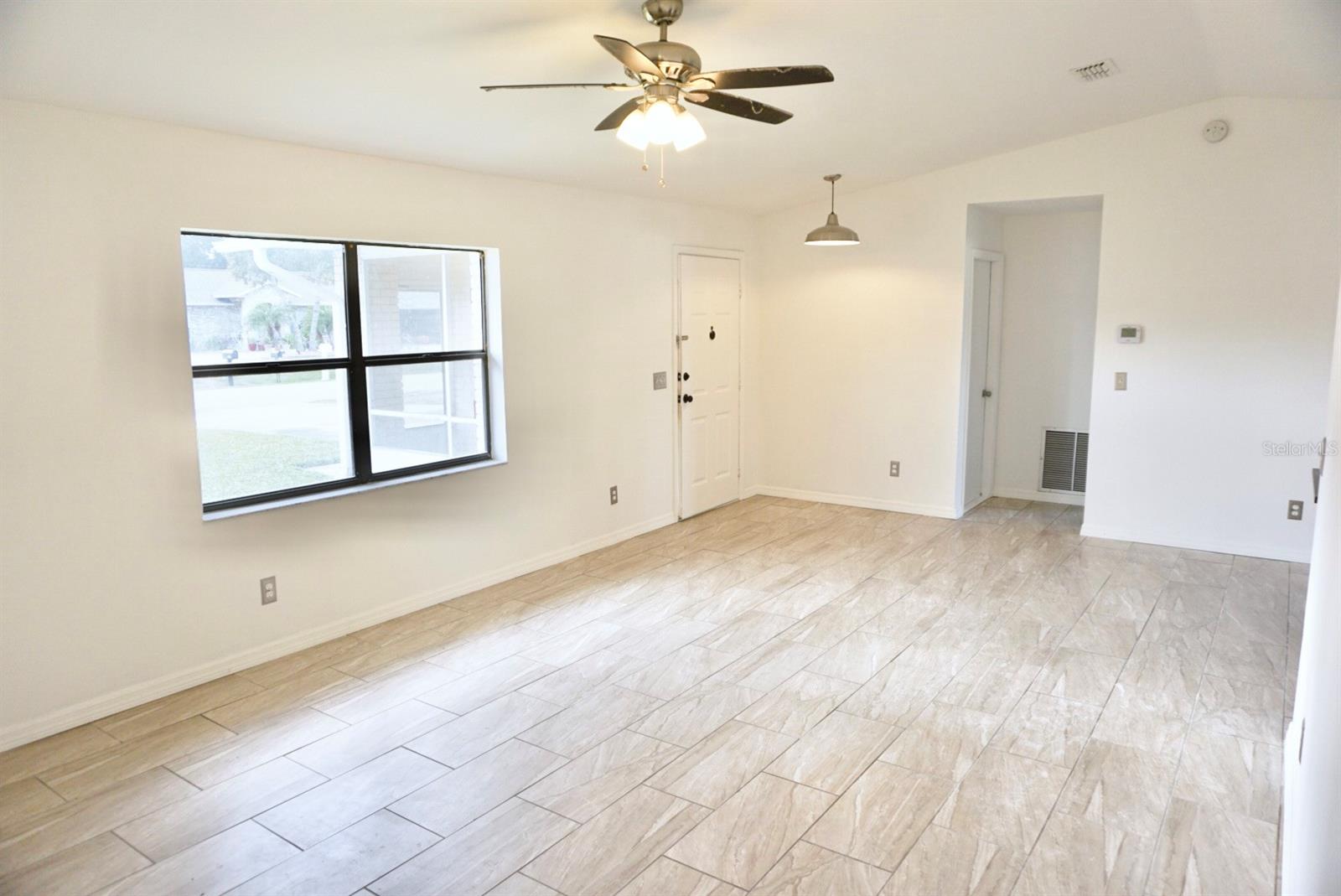 Move-in ready concrete block home in Florida Shores. Freshly painted interior features split bedroom floorpan and newly renovated bathrooms. Cathedral ceilings in living room create a spacious and open feel. Light and bright kitchen and porcelain tile floors throughout. Two car garage offers plenty of storage. Screened patio and large fenced backyard with room for a pool. ;Water: City