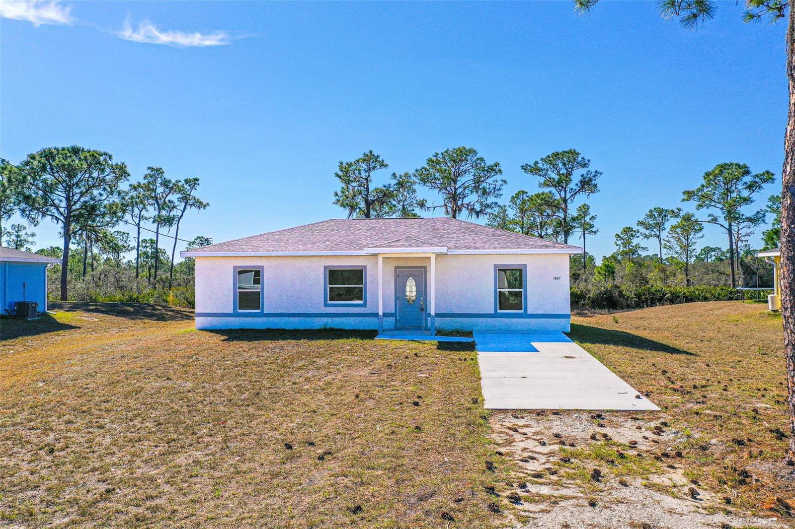 One or more photo(s) has been virtually staged. SELLER AGREES TO CONTRIBUTE UP TO $8,000 TOWARD BUYER’S CLOSING COSTS. Welcome Lake Placid! This stunning, custom-built 2025 home offering 3 bedrooms, and 2 full baths. Enjoy easy Florida living in this inviting home featuring a bright, open-concept layout that seamlessly connects the living, dining, and kitchen areas. Ceramic tile flooring throughout adds durability and turnkey living. The kitchen is equipped with all brand-new stainless steel appliances. The home includes a separate laundry room for convenience. The primary bedroom boasts an ensuite bathroom and a spacious walk-in closet. Step outside to the open back porch, an ideal spot for morning coffee or relaxing evenings, all overlooking a generously sized approximately ¼-acre lot. Located in a USDA-eligible area and no HOA! A one-year home warranty is included for the buyer's confidence! This home is tucked away in a quiet Lake Placid neighborhood yet conveniently close to shopping, dining, and local lakes. Perfect as a full-time residence, seasonal retreat, or investment opportunity.