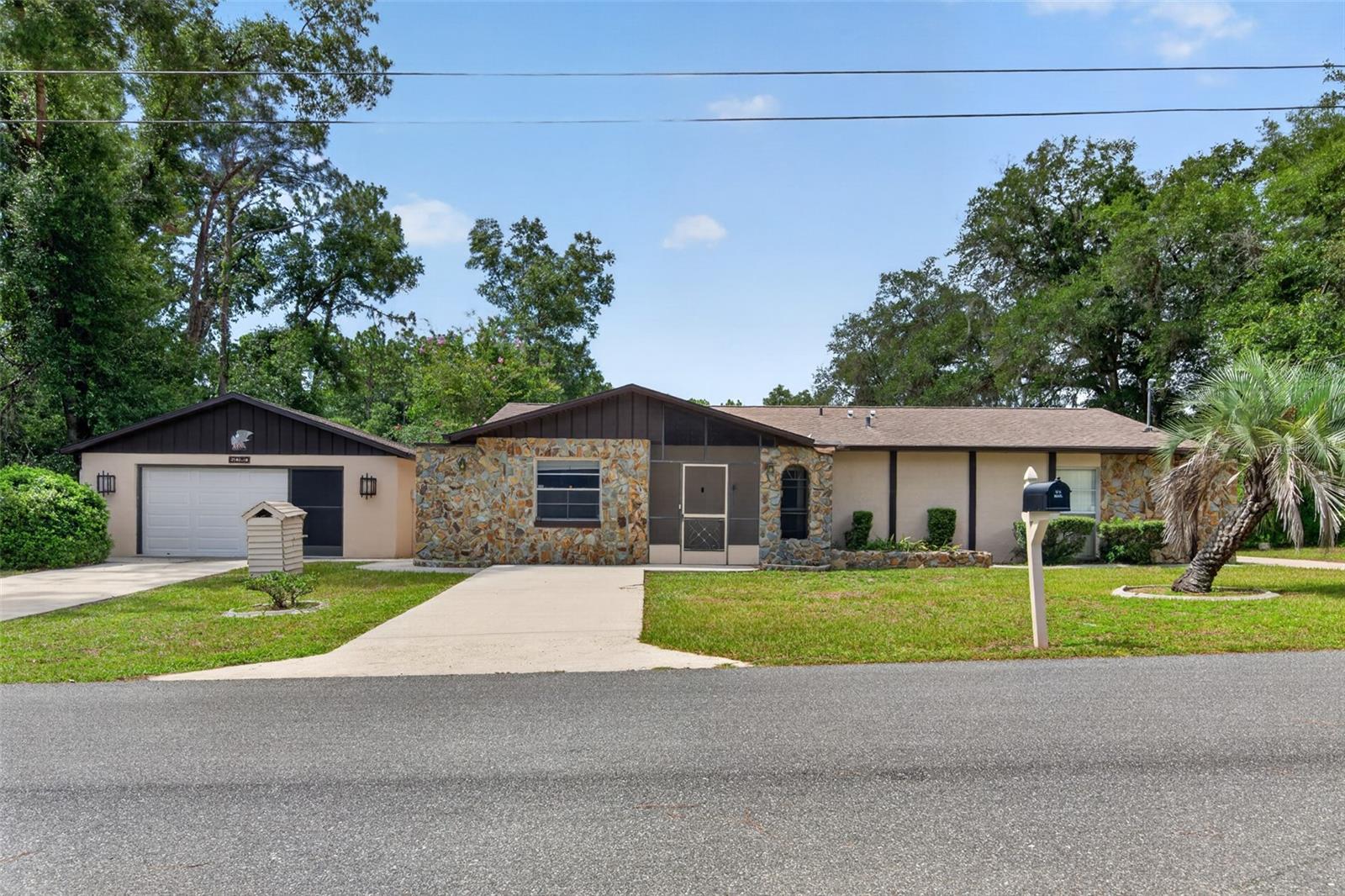 RURAL LIVING plus CONVENIENCE!! Check out this 2 bed, 2 bath POOL home, sitting on a 0.3 acre lot, with a HUGE Detached Garage. Garage has plenty of workshop space totaling 576 square feet. Located in the beautiful & quiet Inverness Highlands where there is NO HOA!! Property is located in NO FLOOD ZONE! Solid Built Home with upgrades including: ROOF 2020, HVAC System 2022, Garage Door Replaced in 2019, Exterior Freshly Painted in April, Pool was partially rescreened in May, Painting and carpet cleaned in both bedrooms. Very spacious Living, additional Den, and Dining area along with sizeable bedrooms that have both been recently painted. This property has Three Concrete Driveways and additional RV/BOAT PARKING WITH ELECTRICAL HOOKUP!! WOW!! NEIGHBORING CORNER LOT IS FOR SALE at 5056 E Prentice Ln and both properties can be included with a cash purchase!
