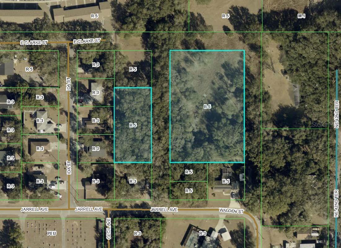 Highly desirable buildable lots in Wildwood.  These lots total 1.83 acres mol.  Lot G05B001 totals 1.3 acres and Lot G05B006 is approximately .45 acres.  These lots are zoned for multiple units so you can maximize the space.  Please note that there are two lots offered for sale.  There is a platted road that separates the two lots.  Utilities are nearby but not on site.  Tree mitigation would be required to build.  Extensive site and utility work would have to be done if wanting to combine the two lots and build several units.  Very little would need to be done to build single family homes.