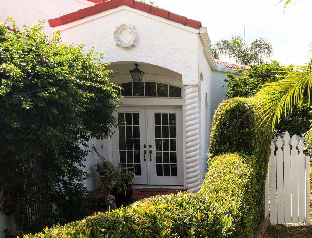 This home is located in one of the best locations in Northwest Bradenton. Minutes to the sugar sand beaches of the Gulf of Mexico, Robinson Preserve with hiking and kayak water trails, and the DeSoto National Park on the banks of the Manatee River. The community common area features 450 feet of trec boat dock, clubhouse, pool, spa, with tennis and pickle ball courts.  Overlooking the Tampa Bay and don't forget the fabulous sunsets.  The home features a contemporary design with high ceilings throughout.  Solid counter top with a spacious eat in counter.  Gas cook top and double oven for the chef in your home.  Premium kitchen wood cabinets.  Separate wet bar with gas burning fireplace.  The master suite has a walk-in closet with washer/dryer.  Separate steeple tub, shower and water closet. Split bedroom design with second bedroom having a full bath and sliding doors to the garden porch area.  Also an over-sized two car garage with side door access.  This home features beautiful landscape throughout the backyard from the covered porch area. Great for entertaining and having cookouts.