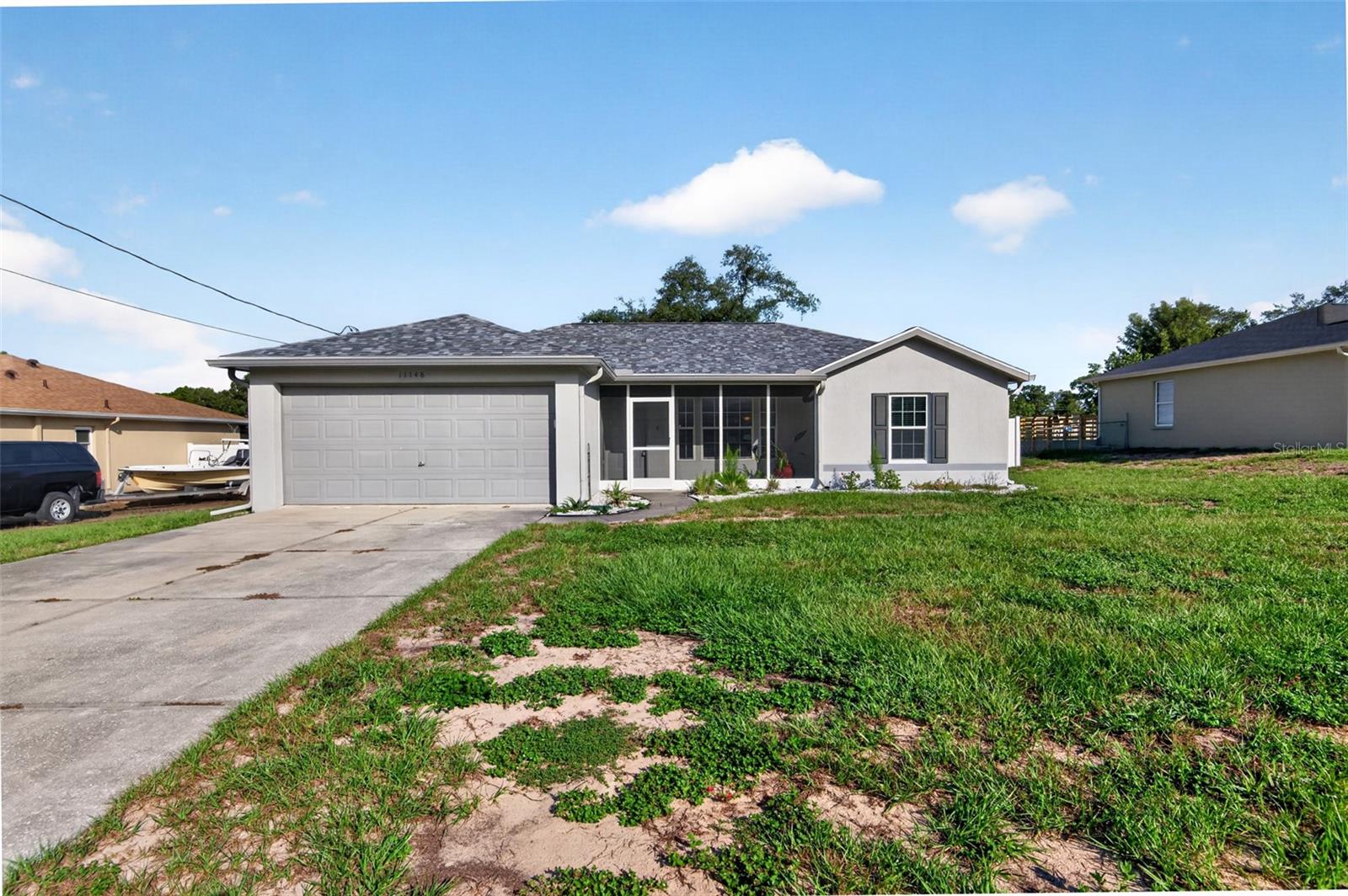 GREAT FIND AT THIS PRICE POINT!! Check out this 3 bed, 2 bath, 2-car garage updated home in a highly, convenient area of Spring Hill. TONS OF UPGRADES: Windows and Doors 2024, Roof 2023, HVAC 2022 and recently serviced this year, Some Fencing Installed in 2021, Screened in Patio 2020, Front Porch enclosed and screened in 2019. BOTH Bathrooms have been completely remodeled. Kitchen feautures beautiful cabinets, stainless steel appliances, with GRANITE counterstops and backsplash all completed within the last 5 years. Very spacious backyard. Highly convienant to grocery stores, retail, medical facilities, and many more amenities in Hernando County. Less than 5 minutes to the Pasco County line.
