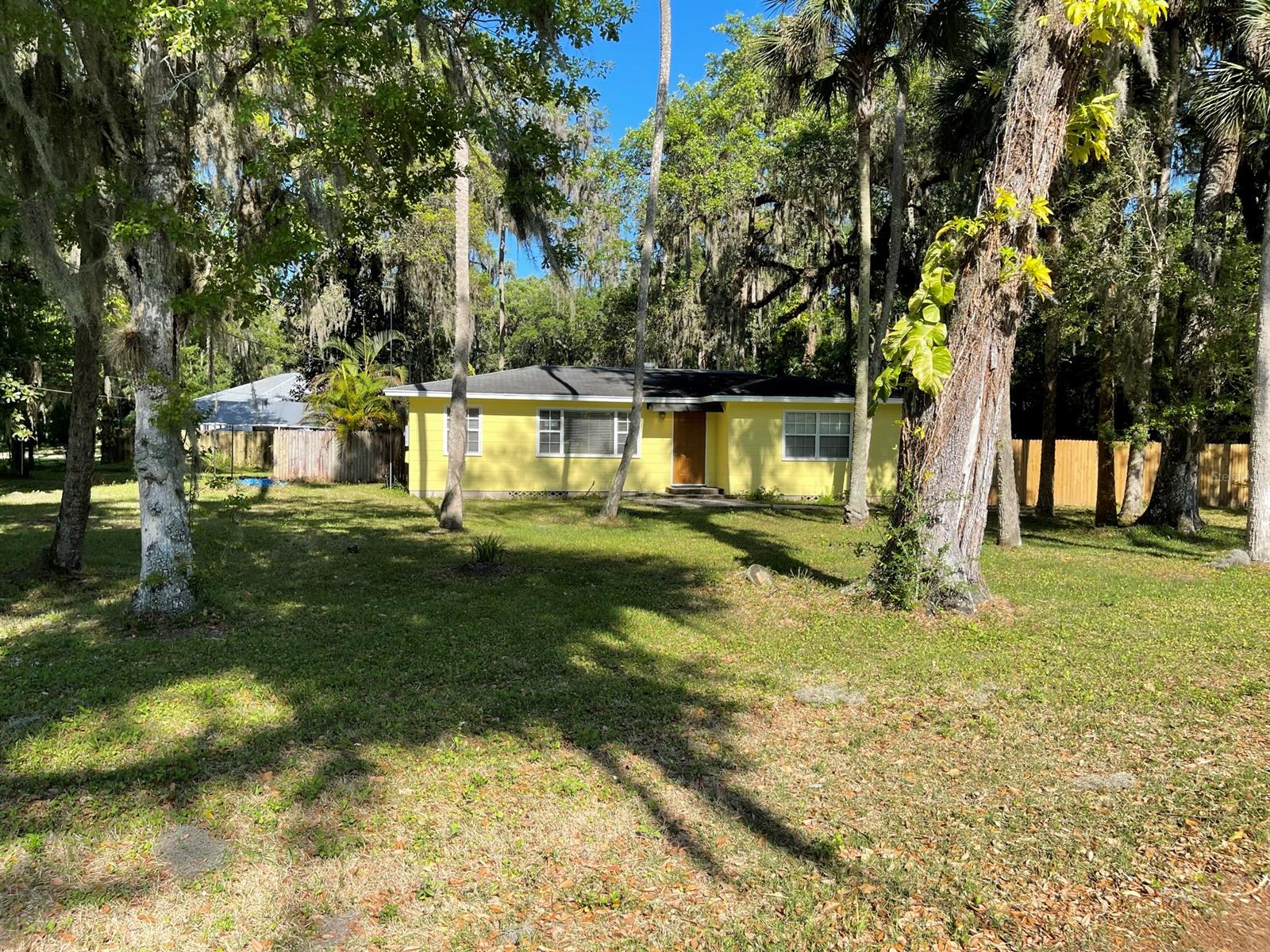 Enjoy this serene wooded oversized property with NO HOA! 2/1 Home with plenty of room to grow & ready for its new owners to make it their own. Real hardwood flooring throughout. This home invites you with recently upgraded real wood cabinets & granite countertops. New double pane windows throughout & a new AC. Rare find 150 x 150 double corner lot in highly sought after area of New Smyrna Beach. Close to schools, shopping, restaurants, and 10 minutes to the beach. Enjoy all that this town has to offer with weekly & monthly activities by the downtown area and the beach. All information intended to be accurate, but cannot be guaranteed. ;Water: City
